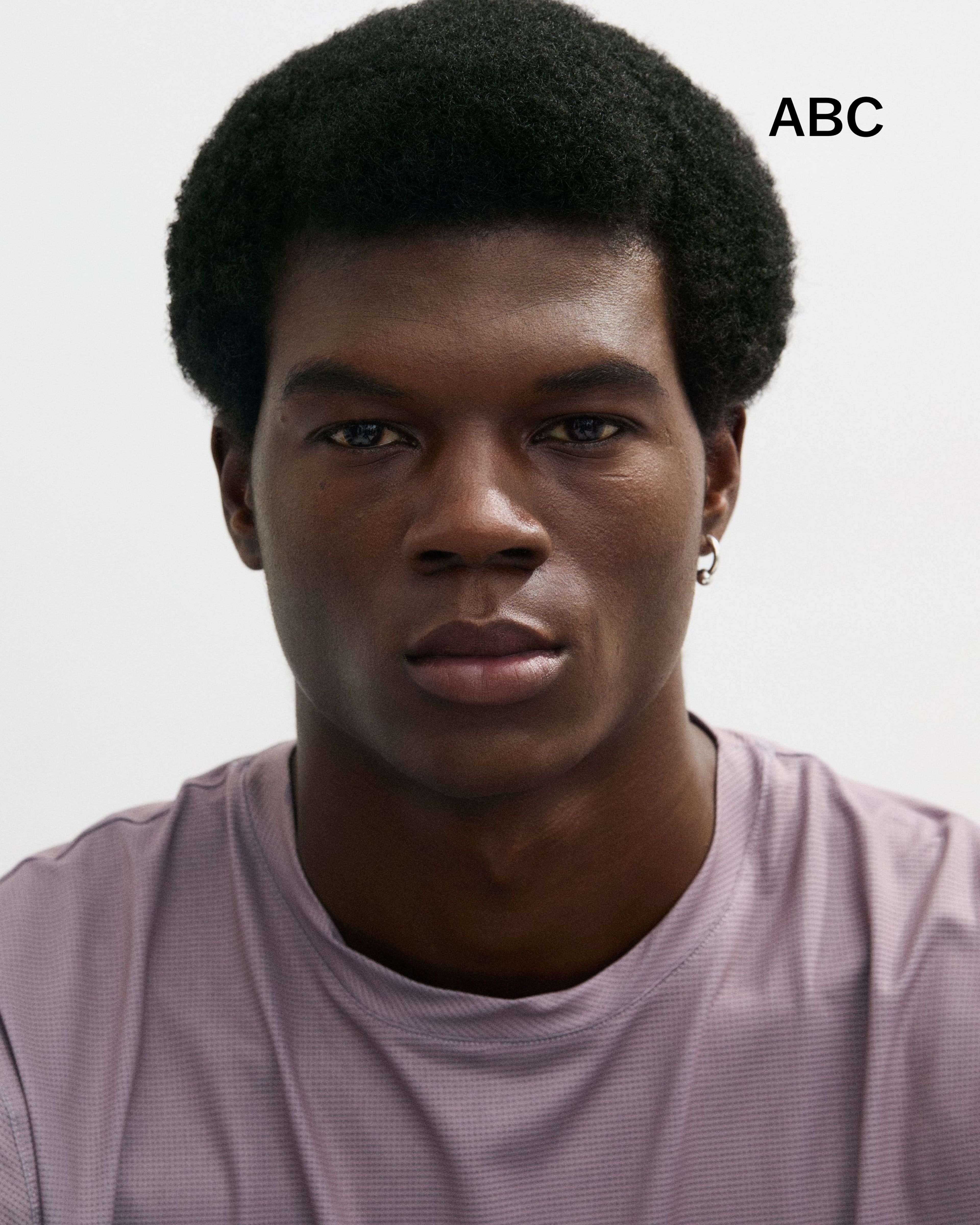 Enhancing Lip Balm laying on a grey surface