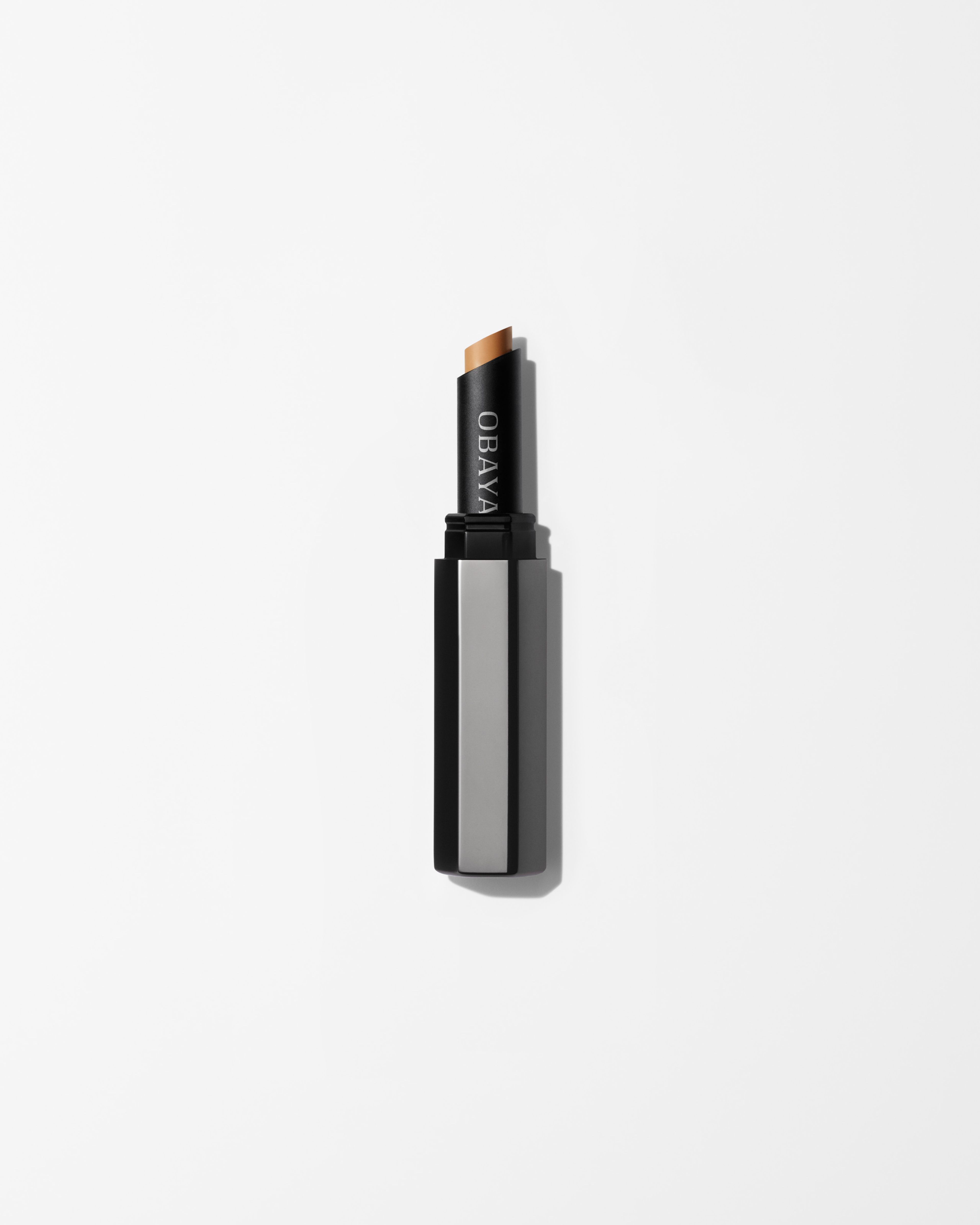  Concealer laying on a grey surface
