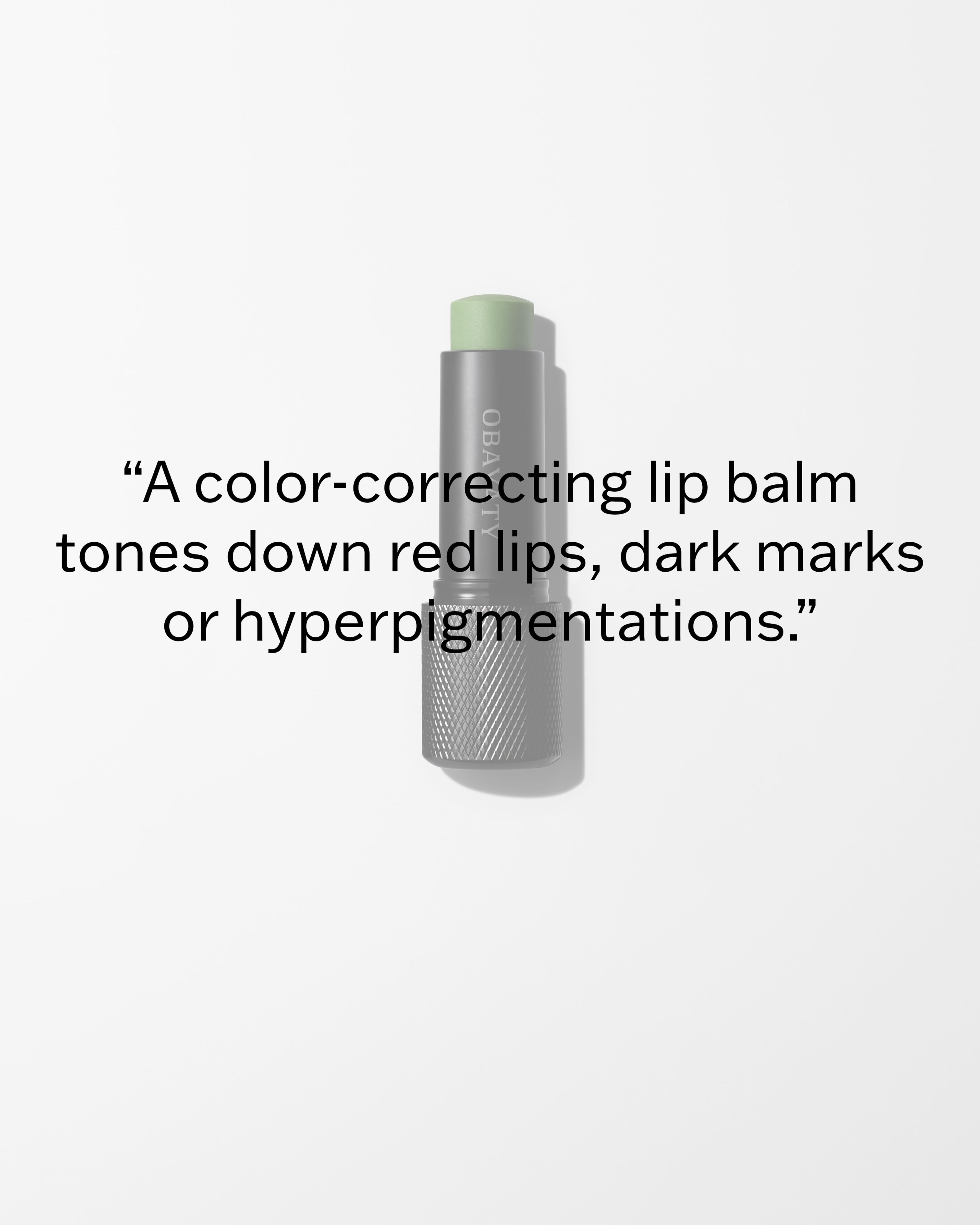 Mens lip balm laying on a grey surface.