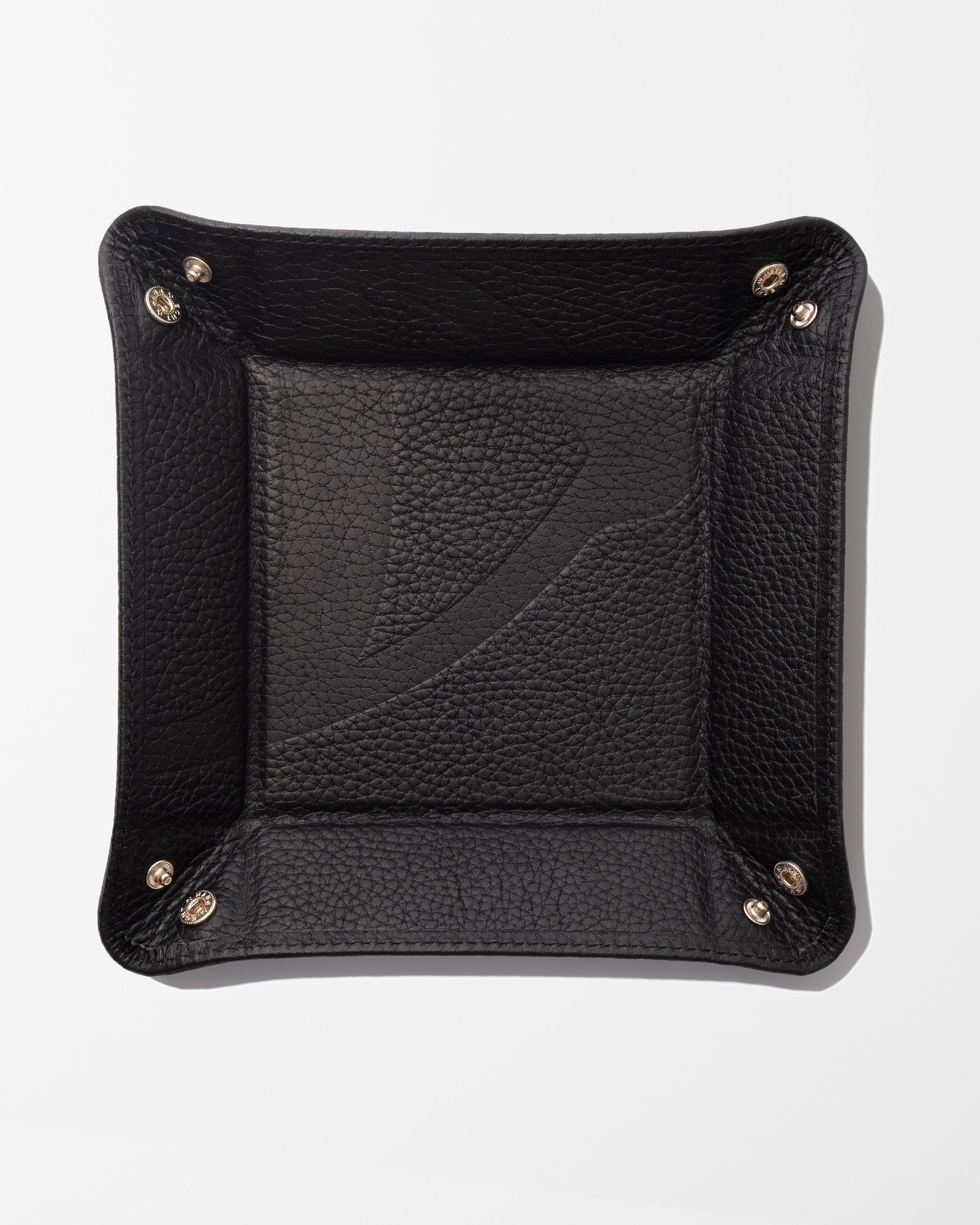Photo of a black leather tray