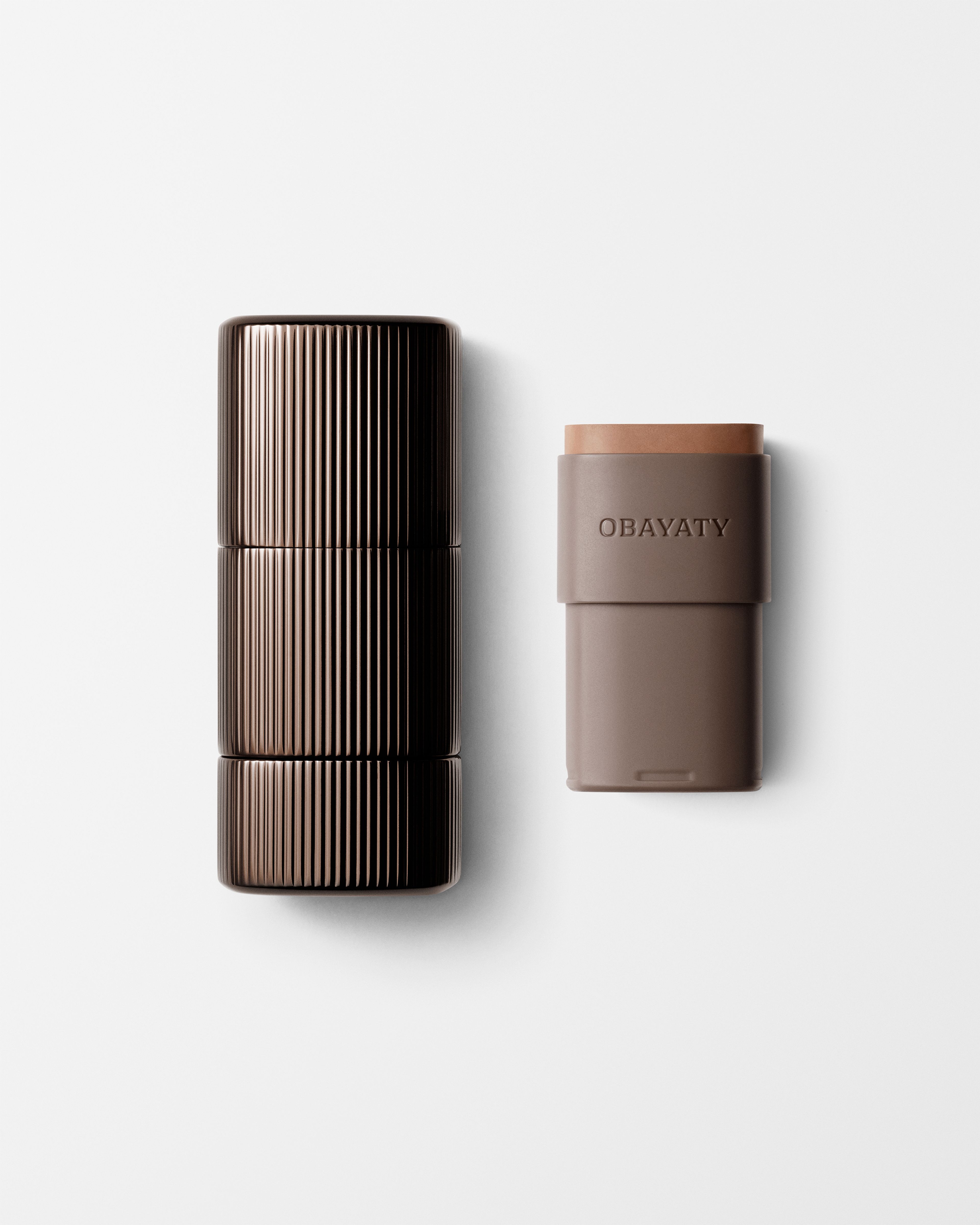 Bronzer for men laying on a grey surface