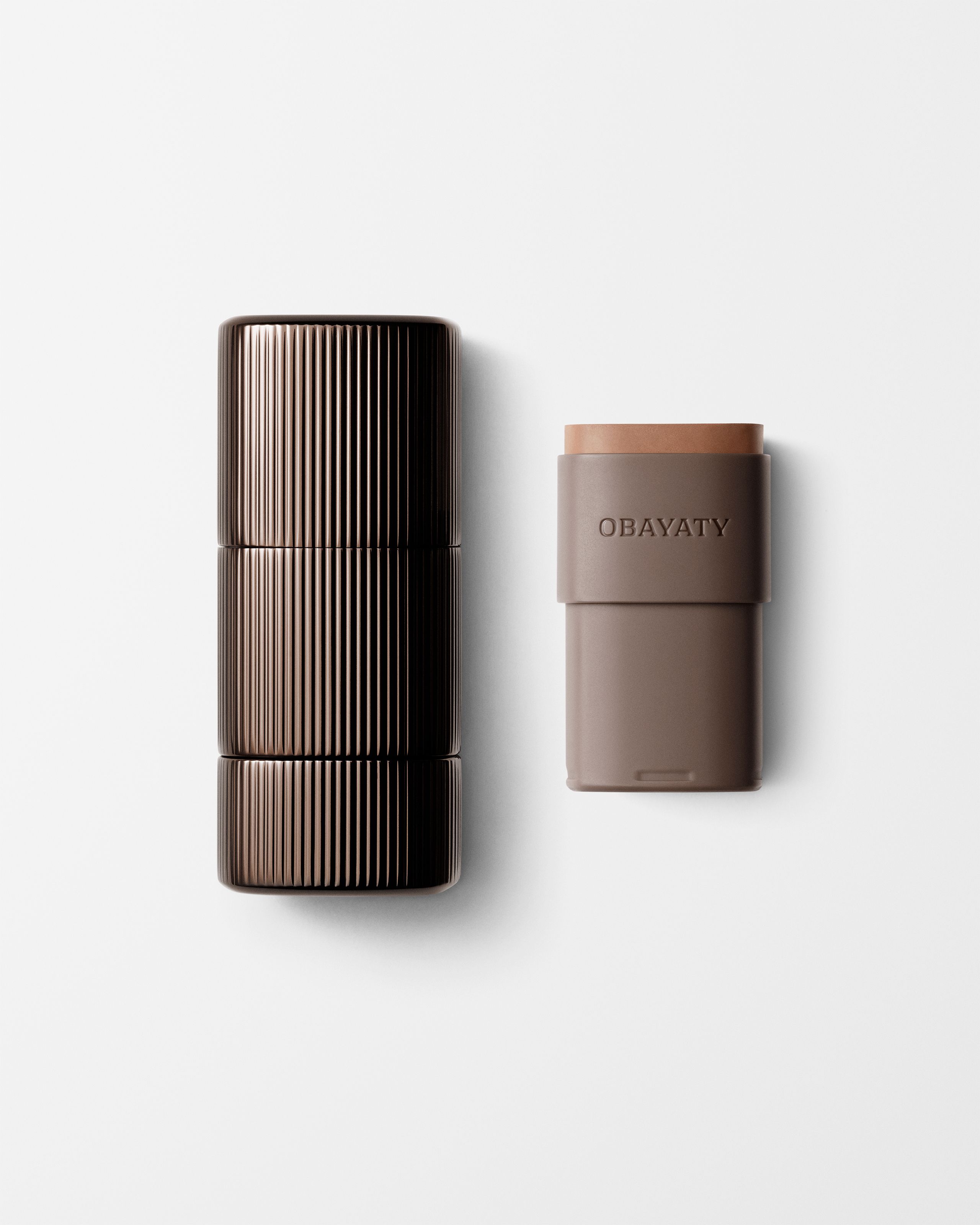 Bronzer for men laying on a grey surface