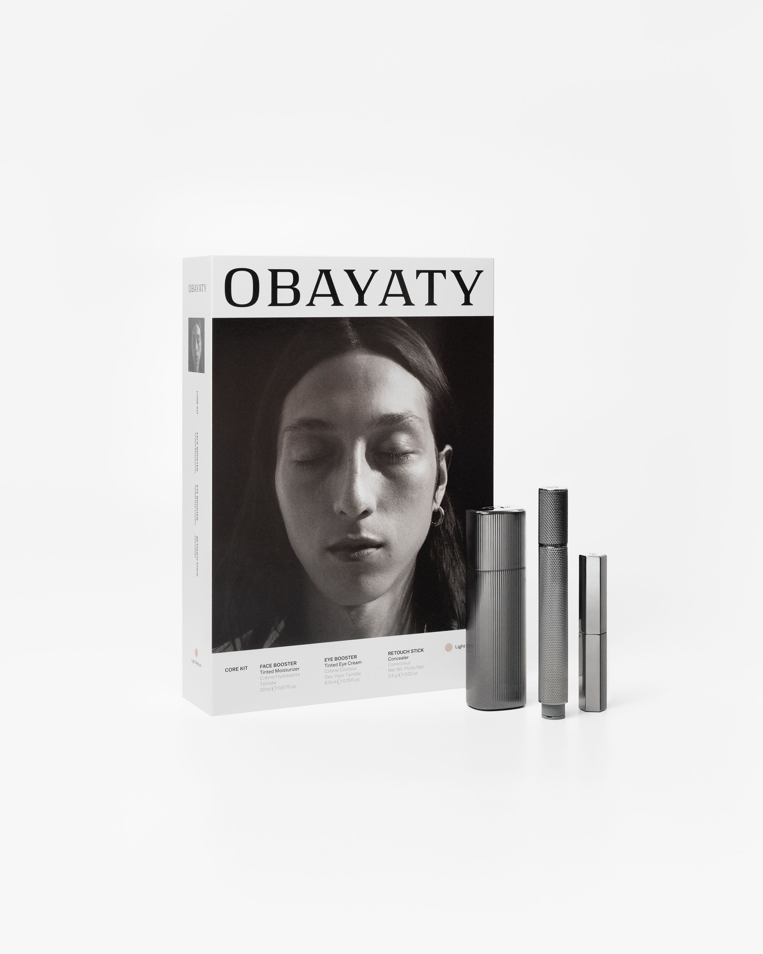 Make up kit for men laying on a grey background