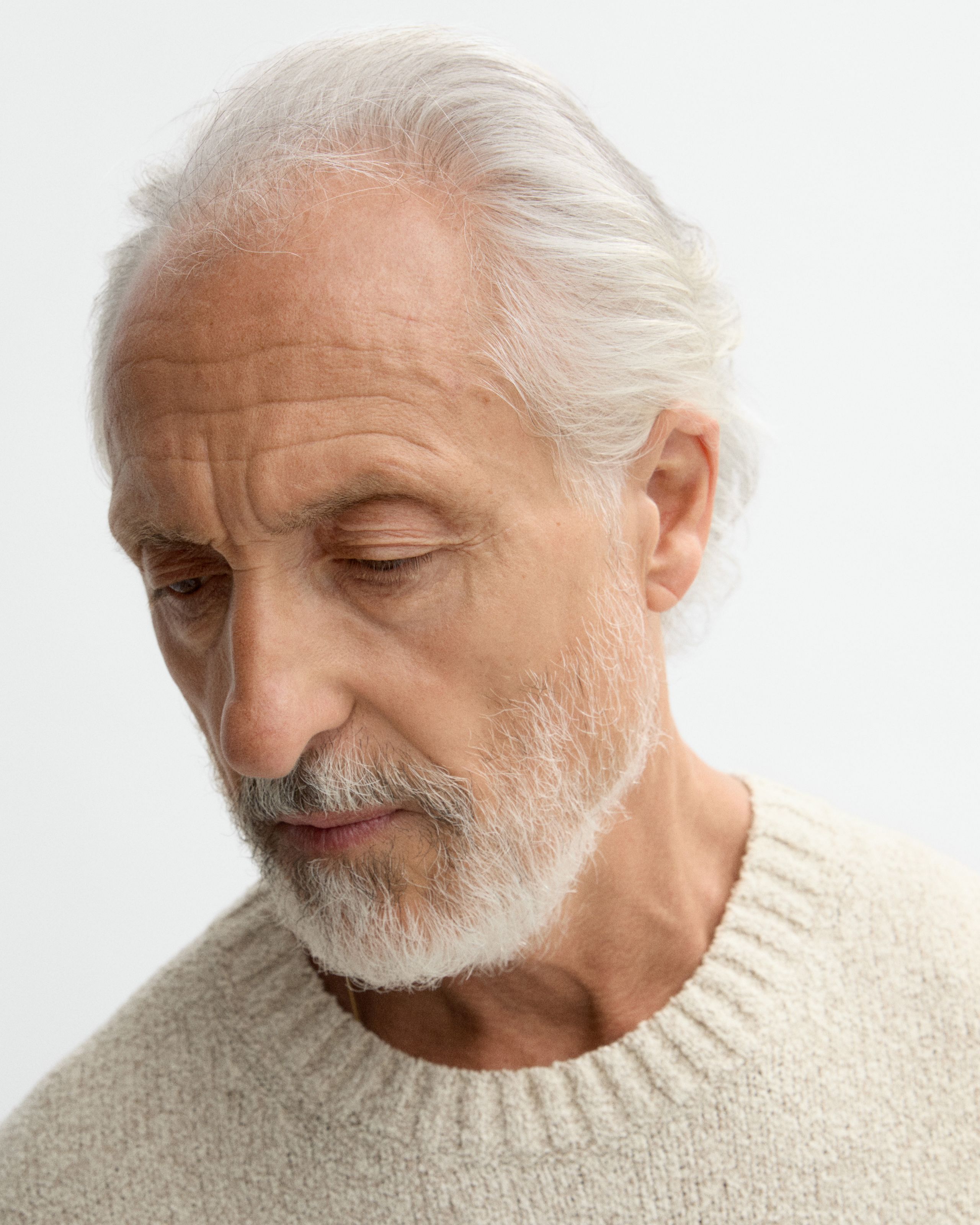 Model with tinted eye cream applied