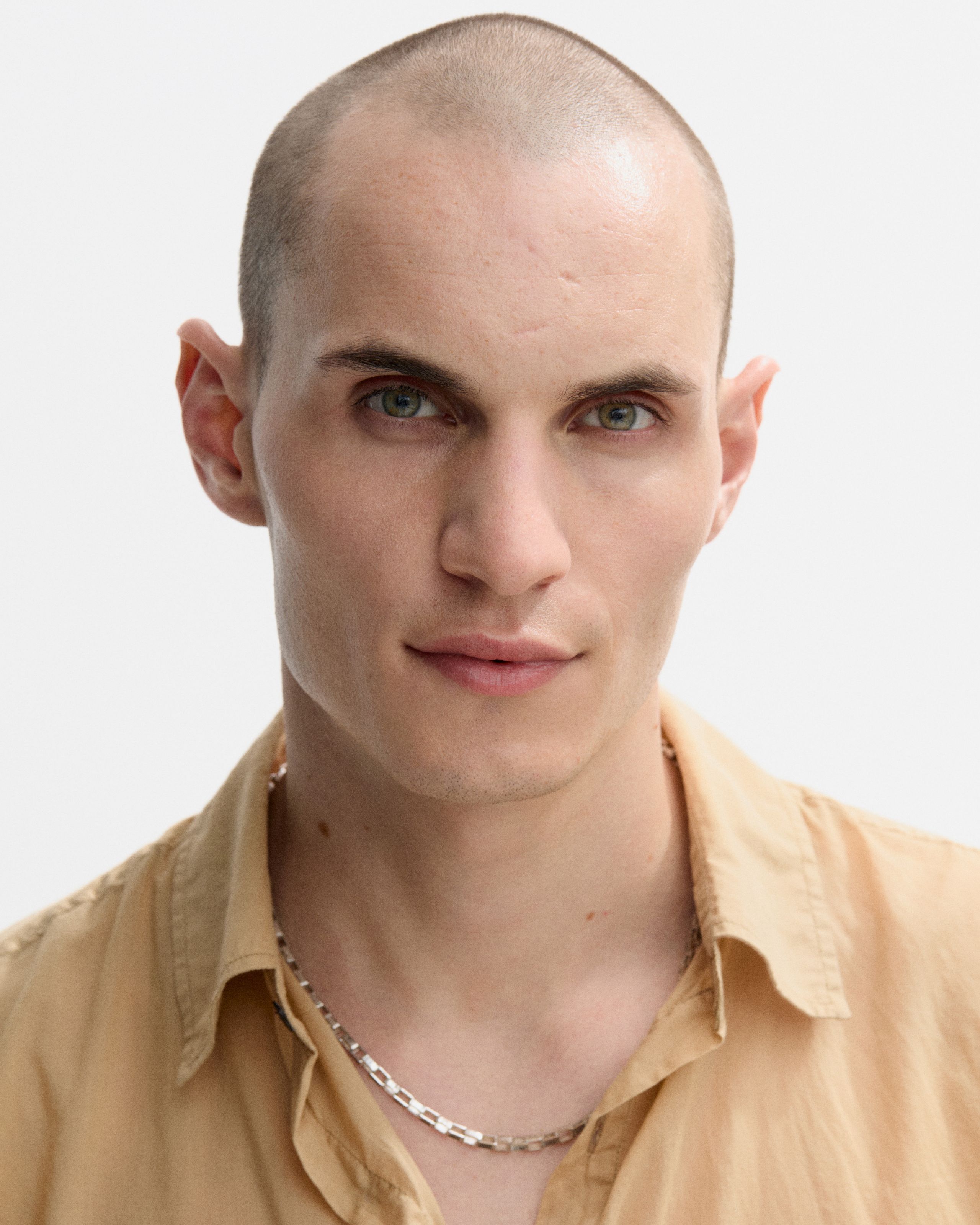 Men's make up kit laying on a grey background