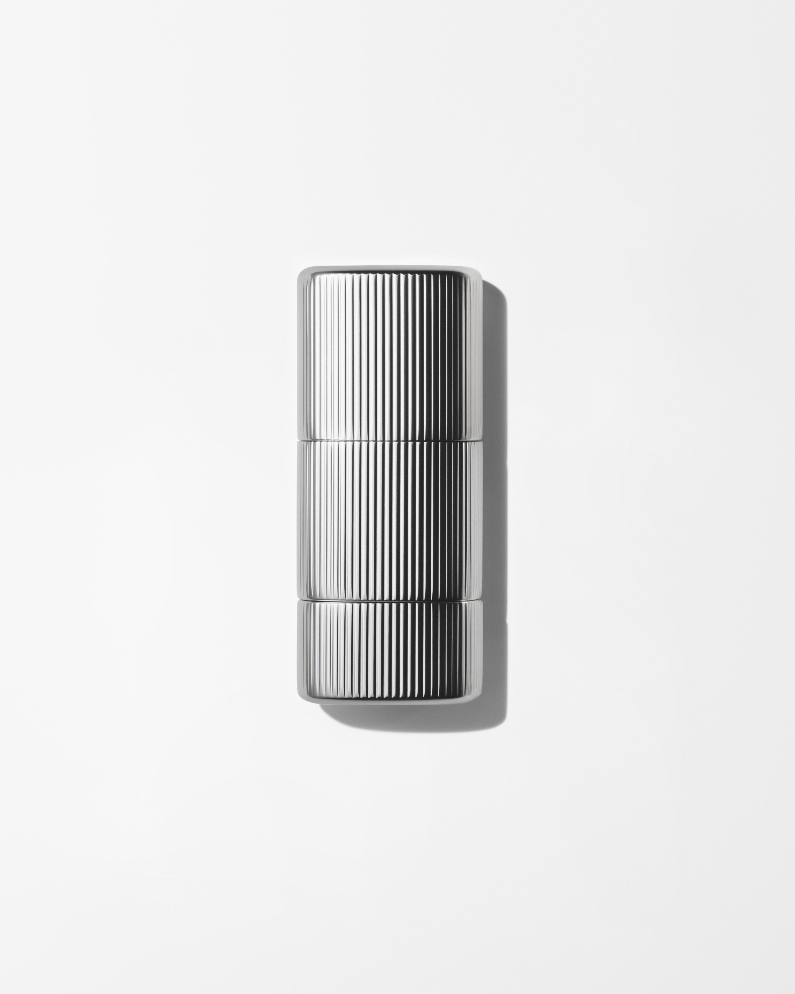 Concealer for men laying on a grey background