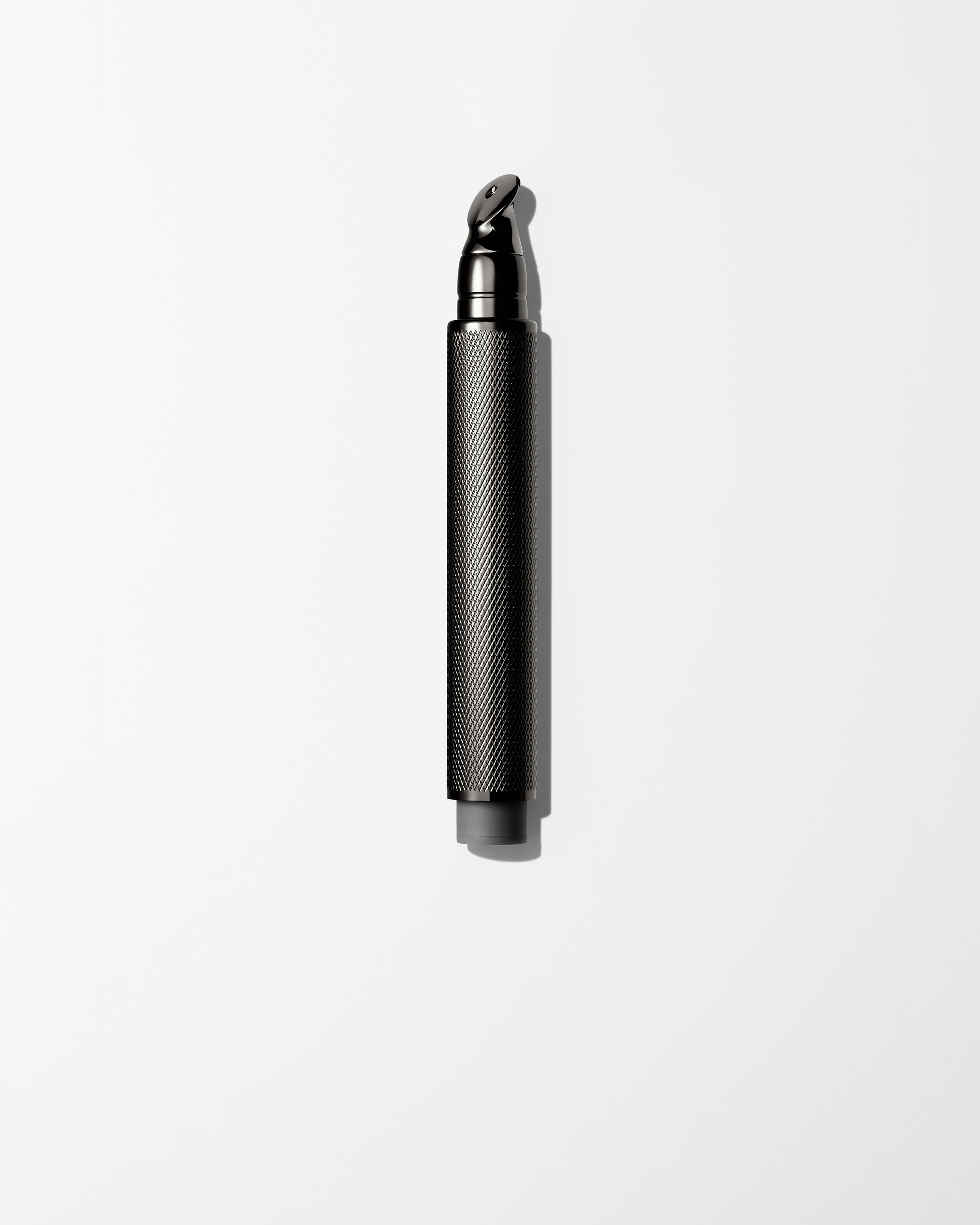 Men's eye cream laying on a grey surface