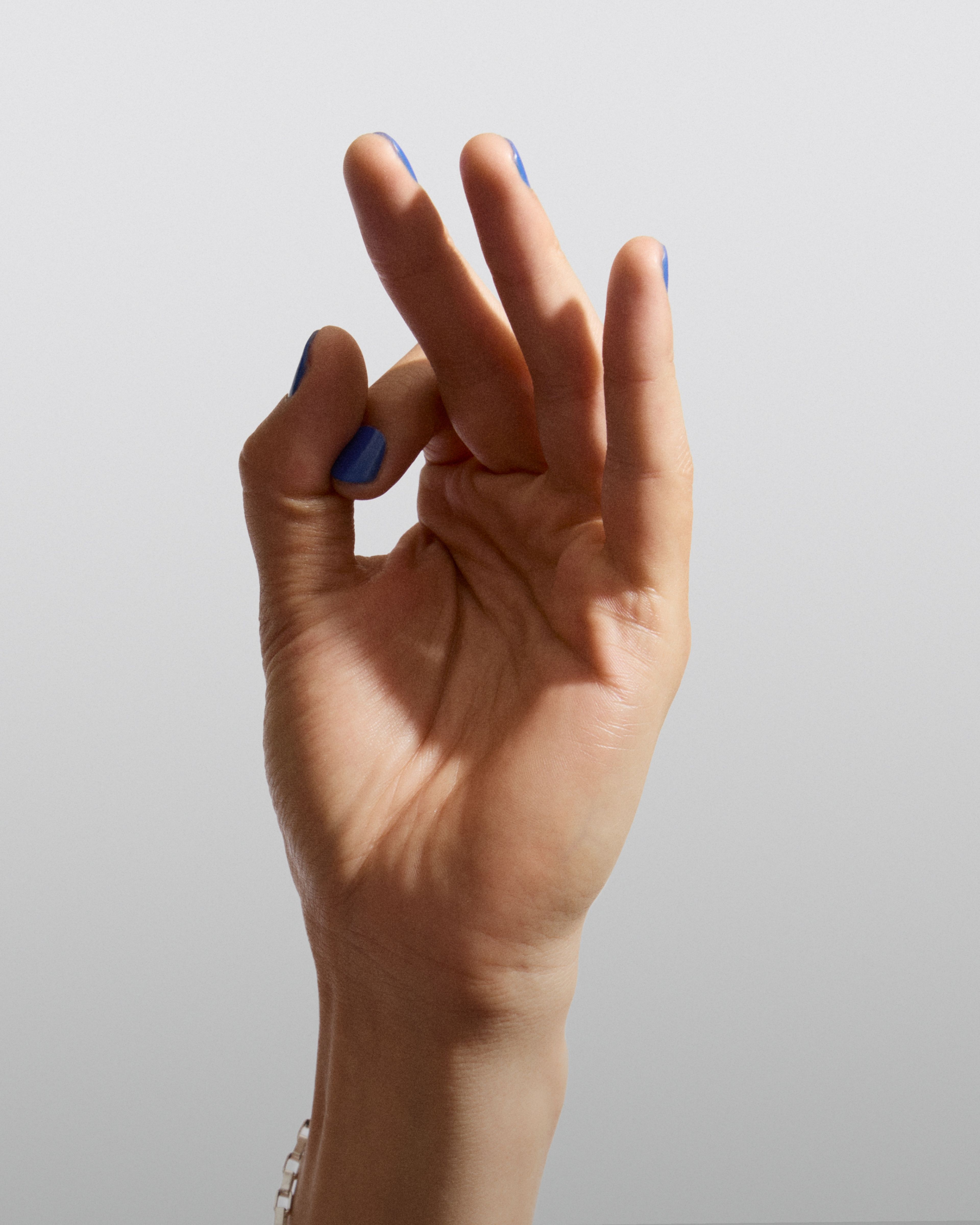 Hand wearing nail color