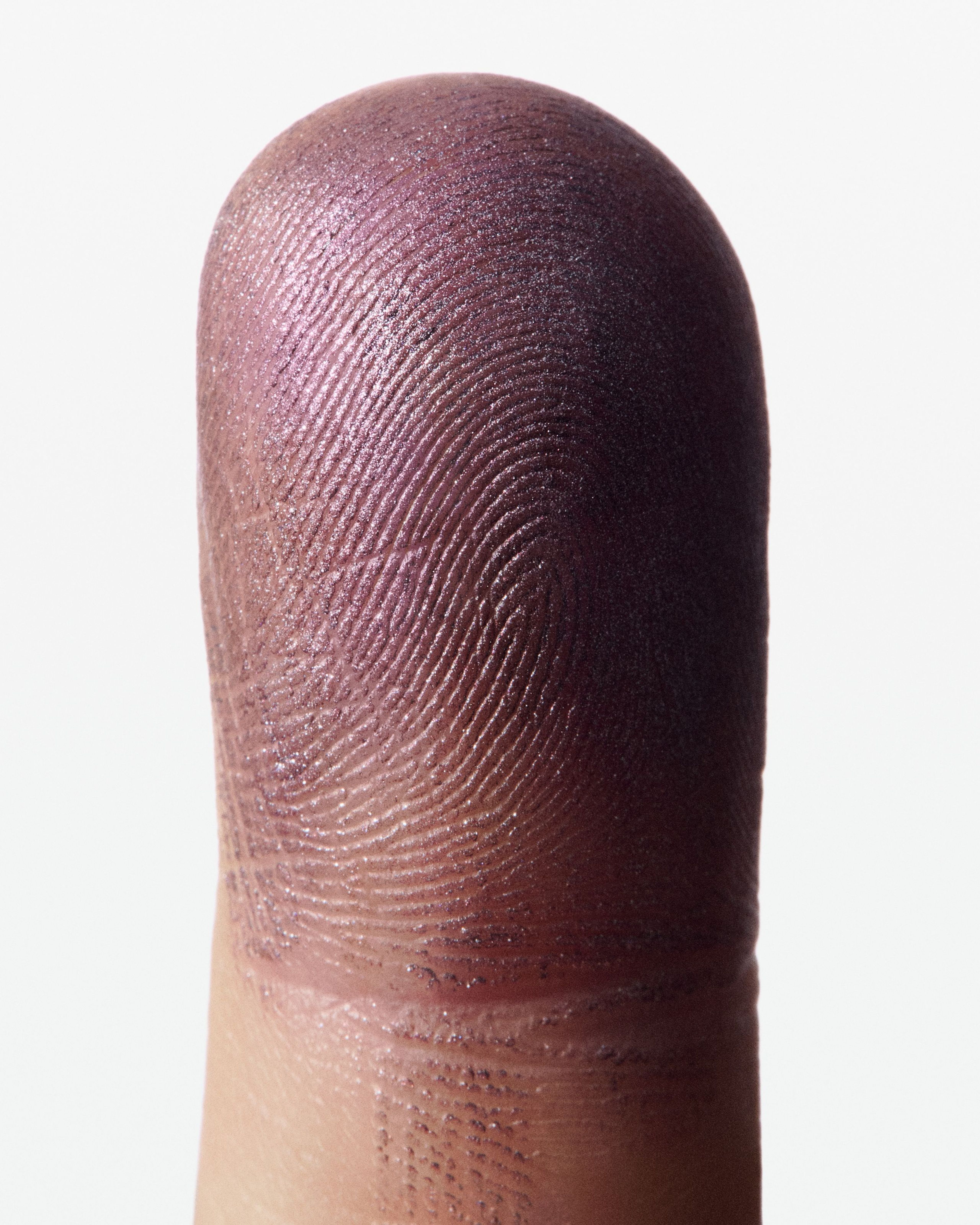 Eye Pen Purple Haze formula on a finger