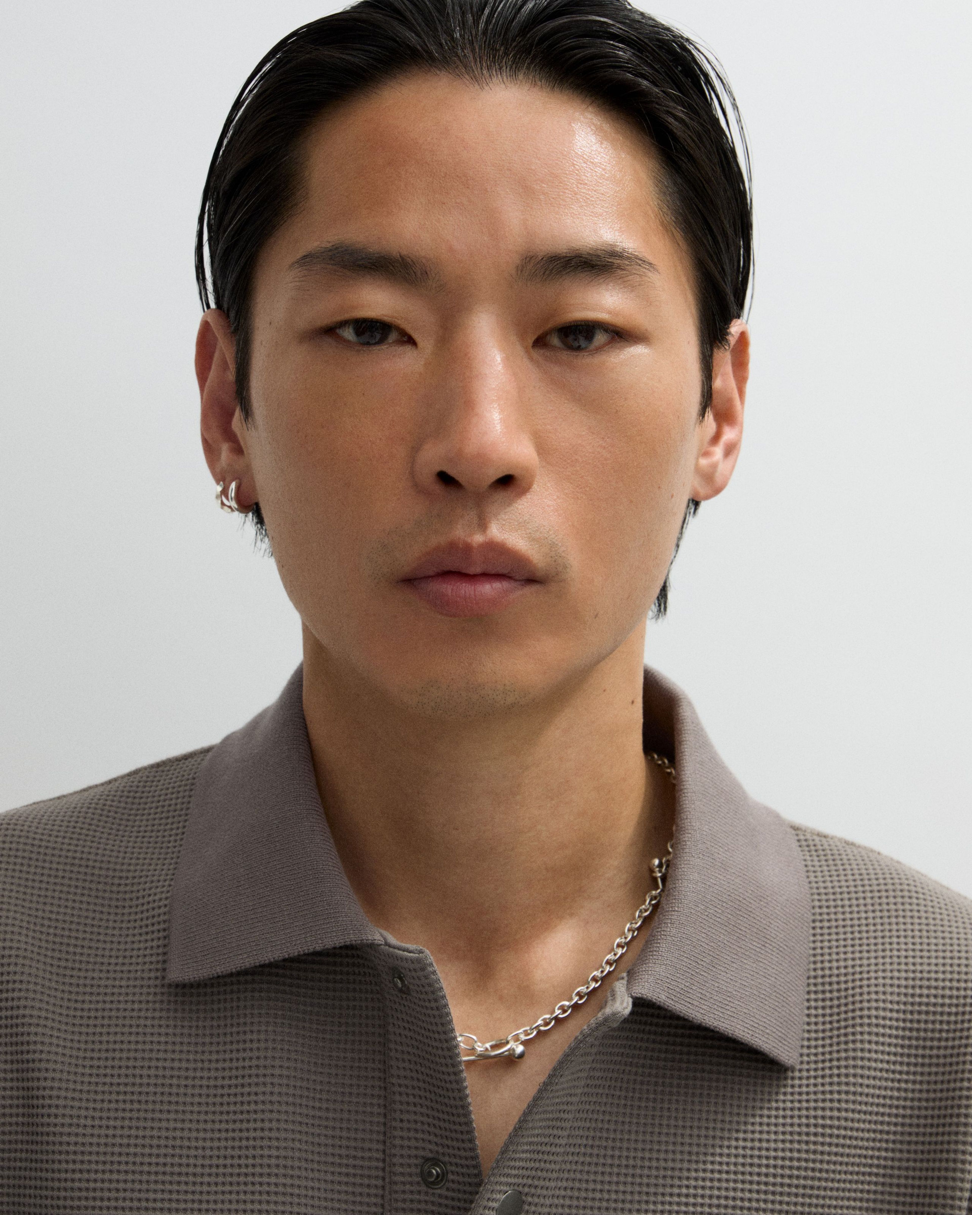 Man looking in to the camera with the mens concealer applied