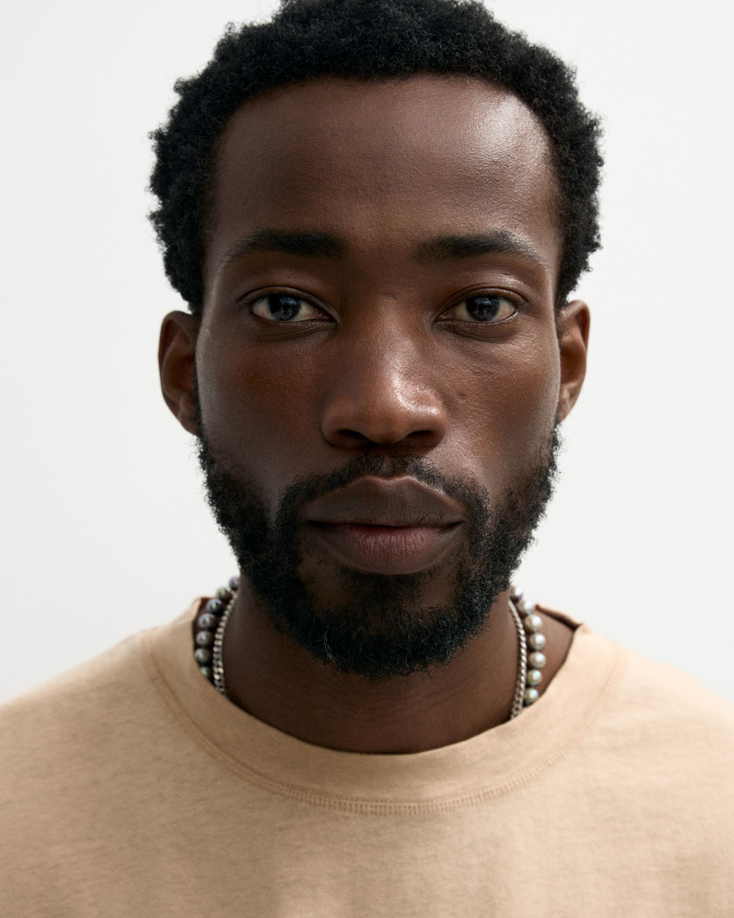 Man looking in to the camera with the mens concealer applied