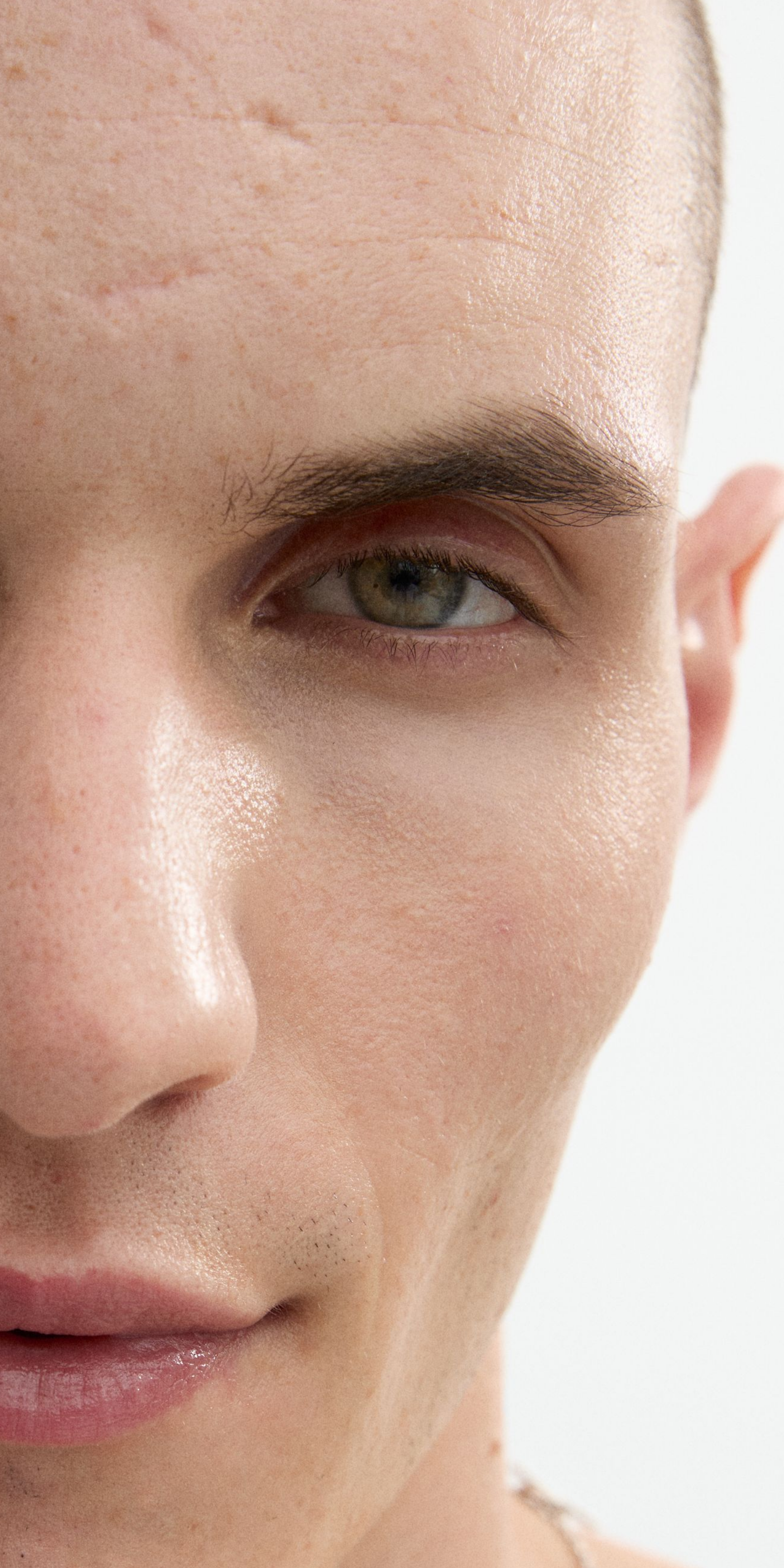 Man looking into the camera with eye booster applied