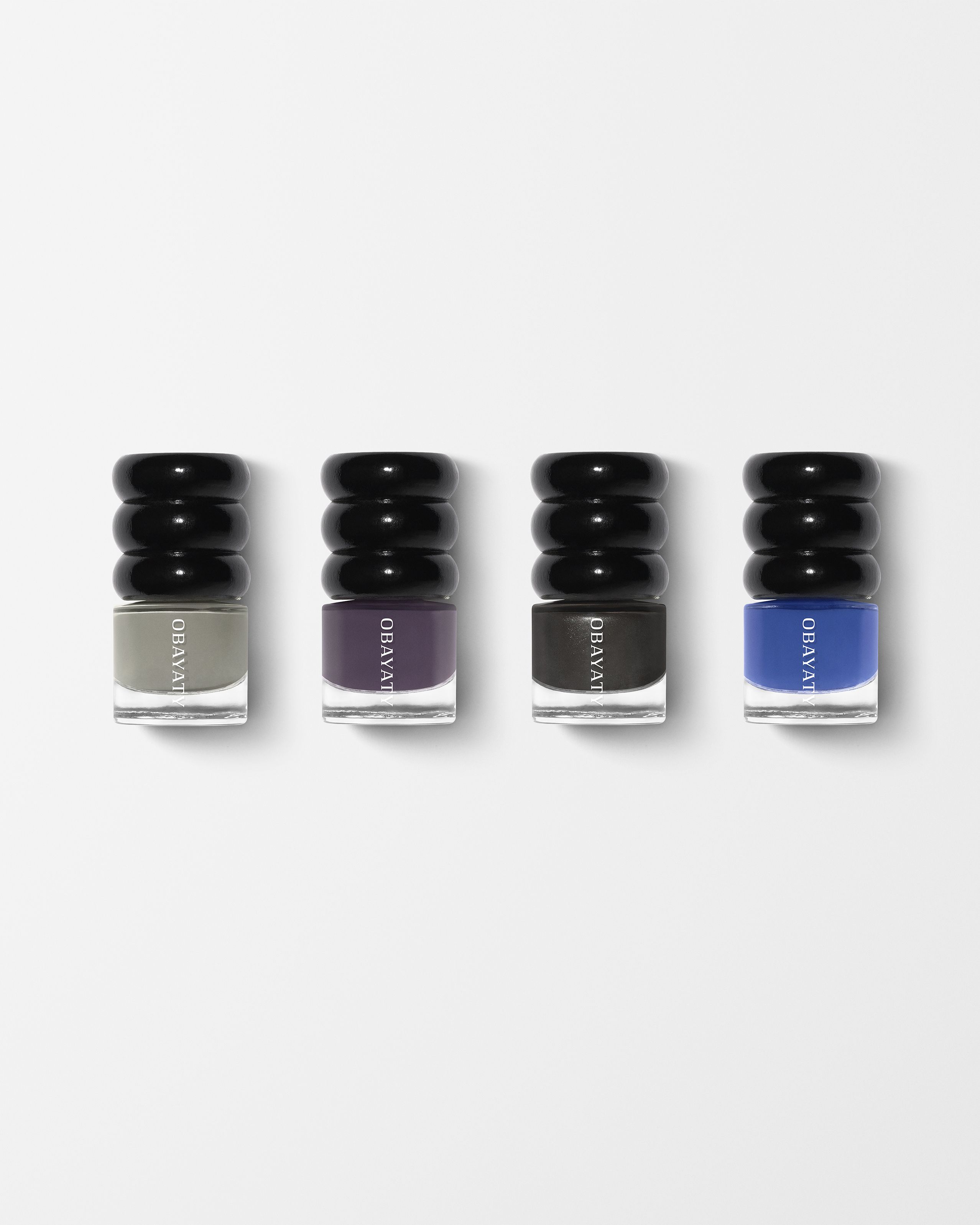 Nail polish for men laying on a grey surface