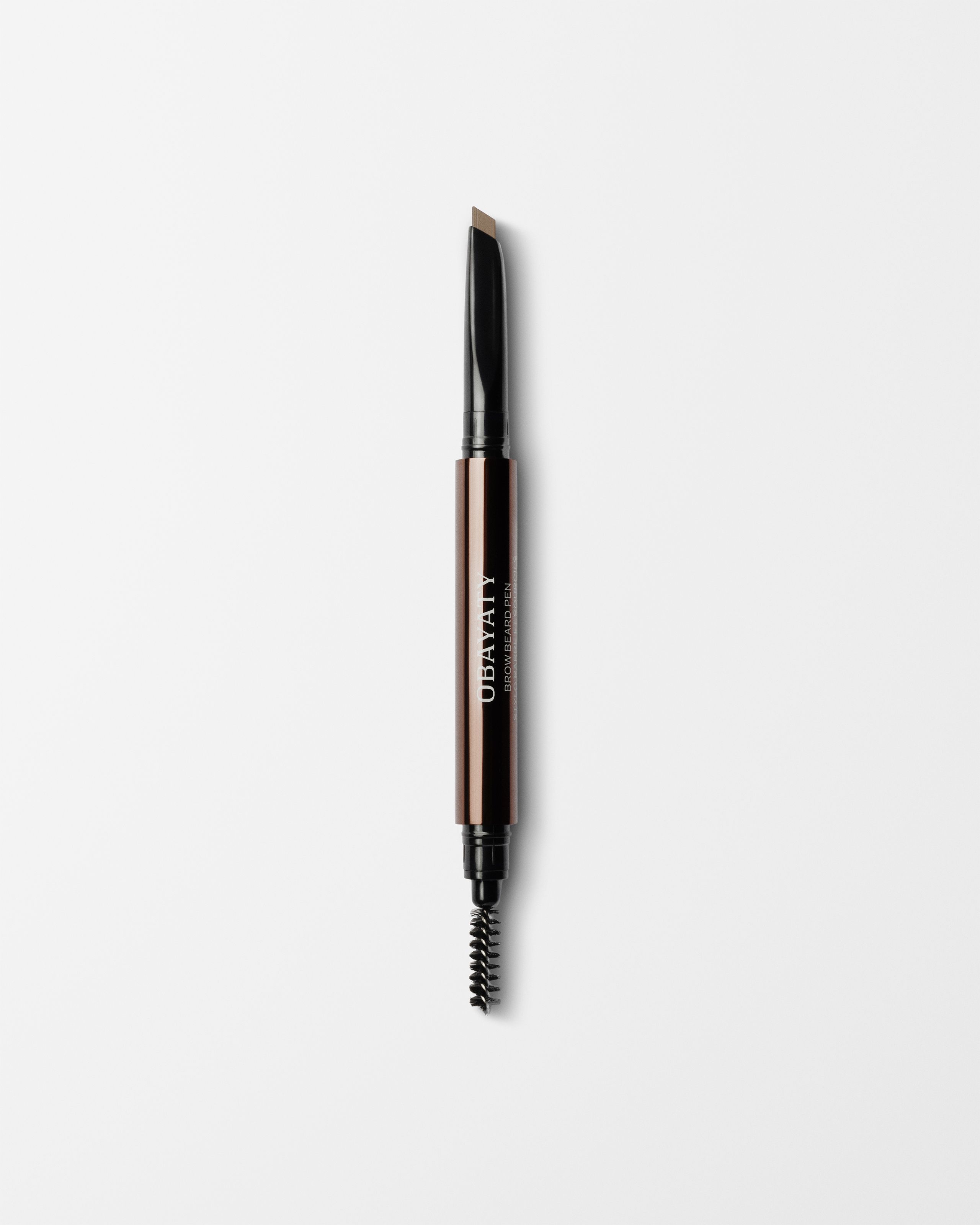 Brow Beard Pen for men laying on a grey surface