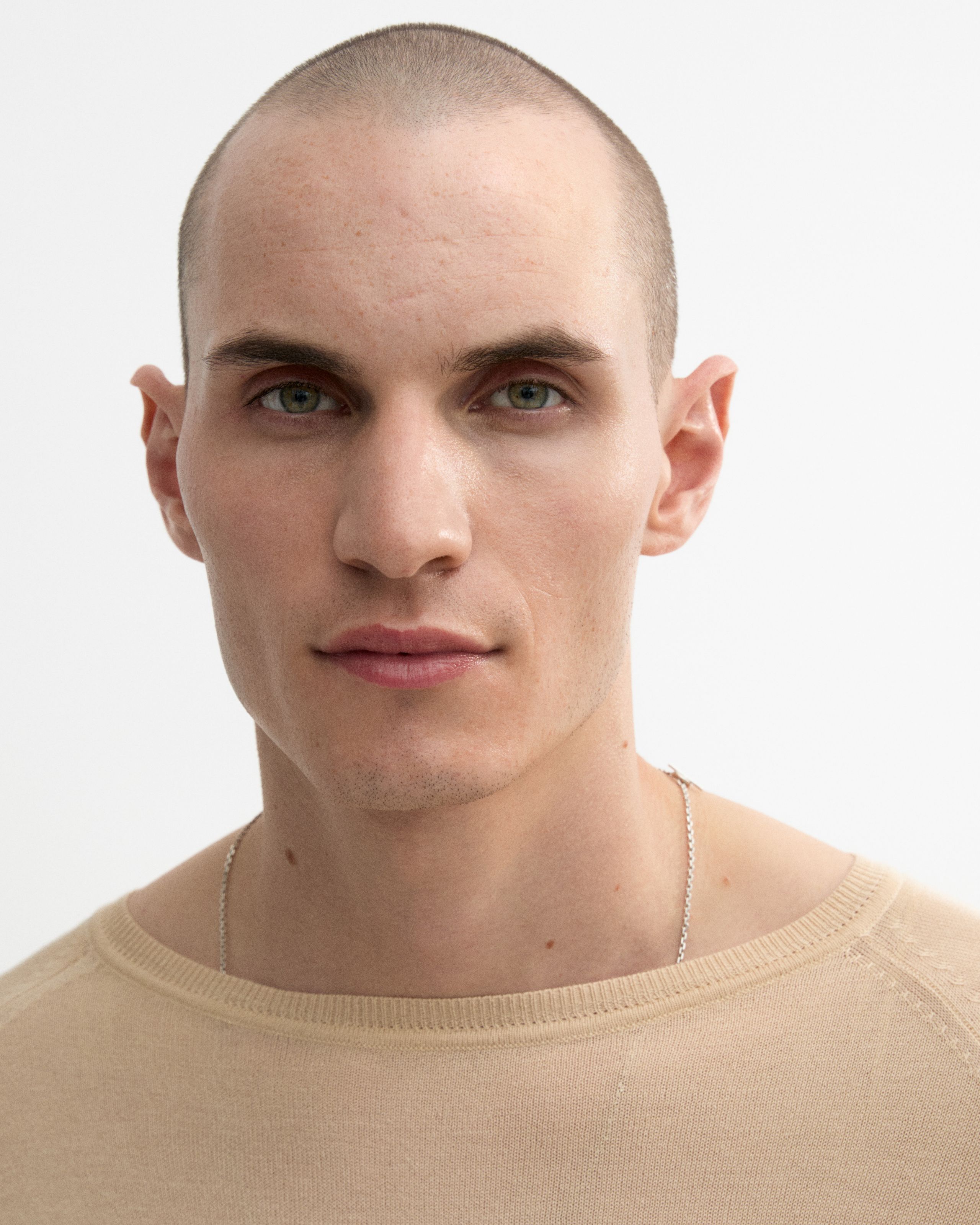 Man looking into the camera with tinted moisturizer applied