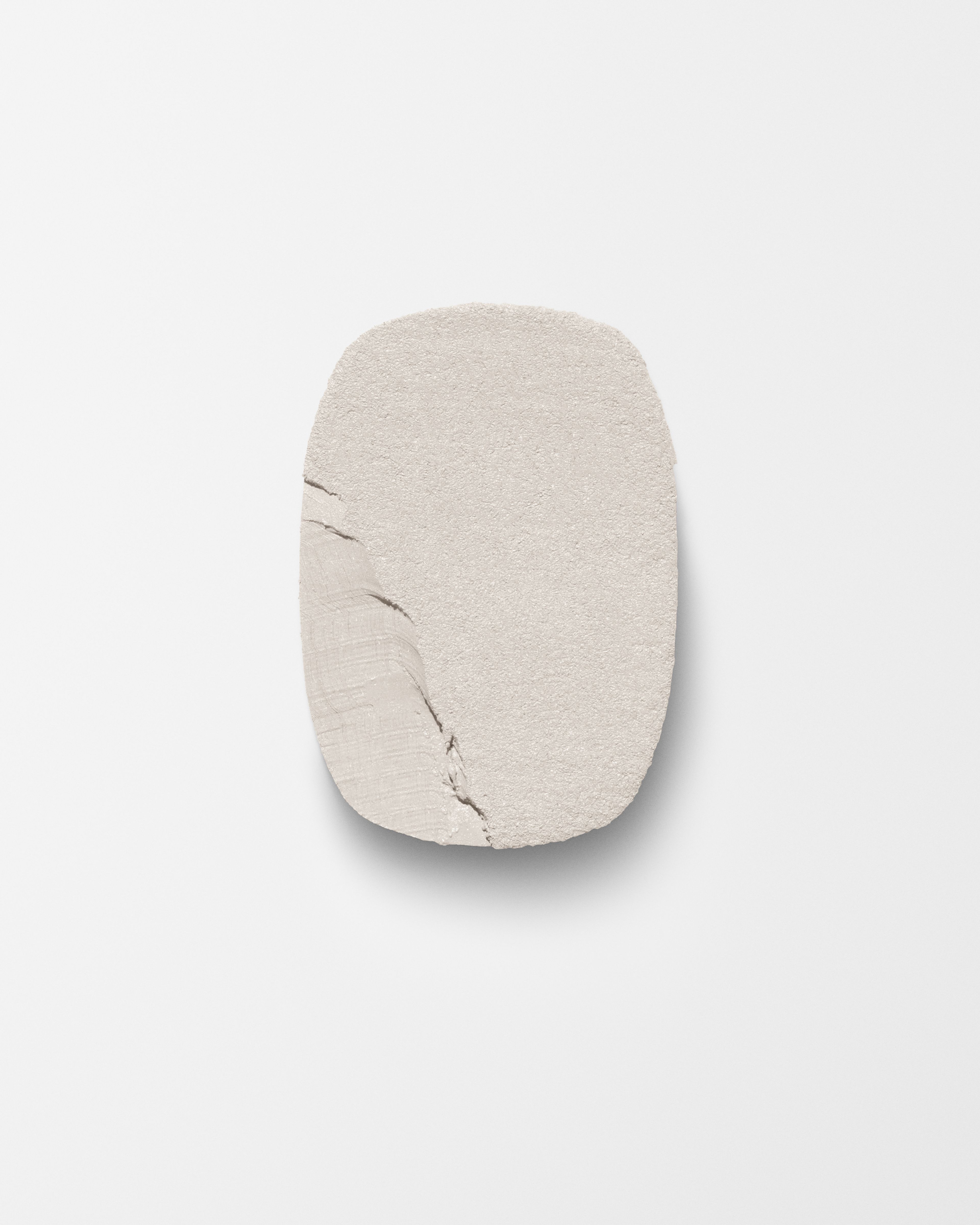 Highlighter refill laying on a grey surface