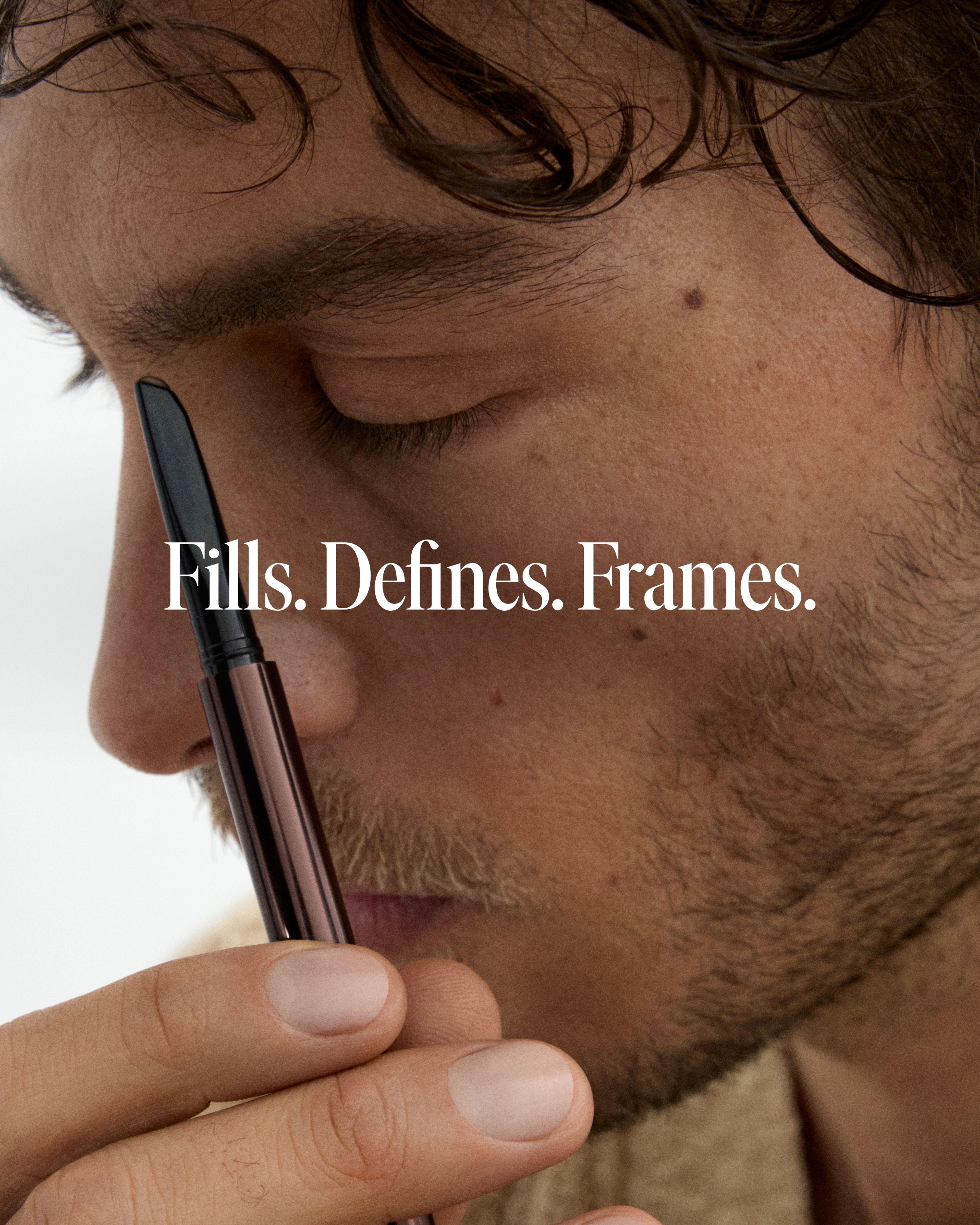 Image of man applying brow beard pen