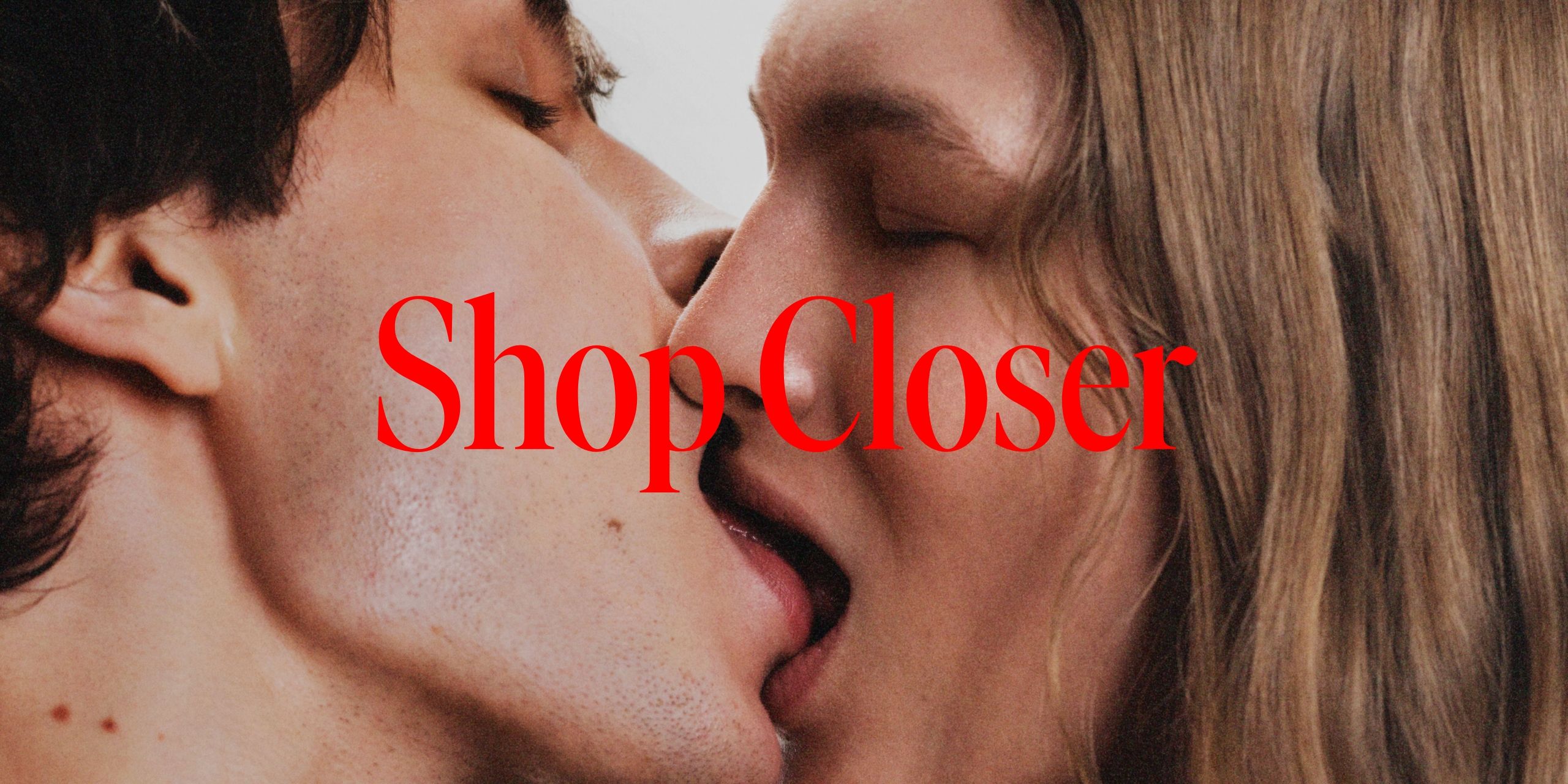 Two people kissing with the text closer shop on top