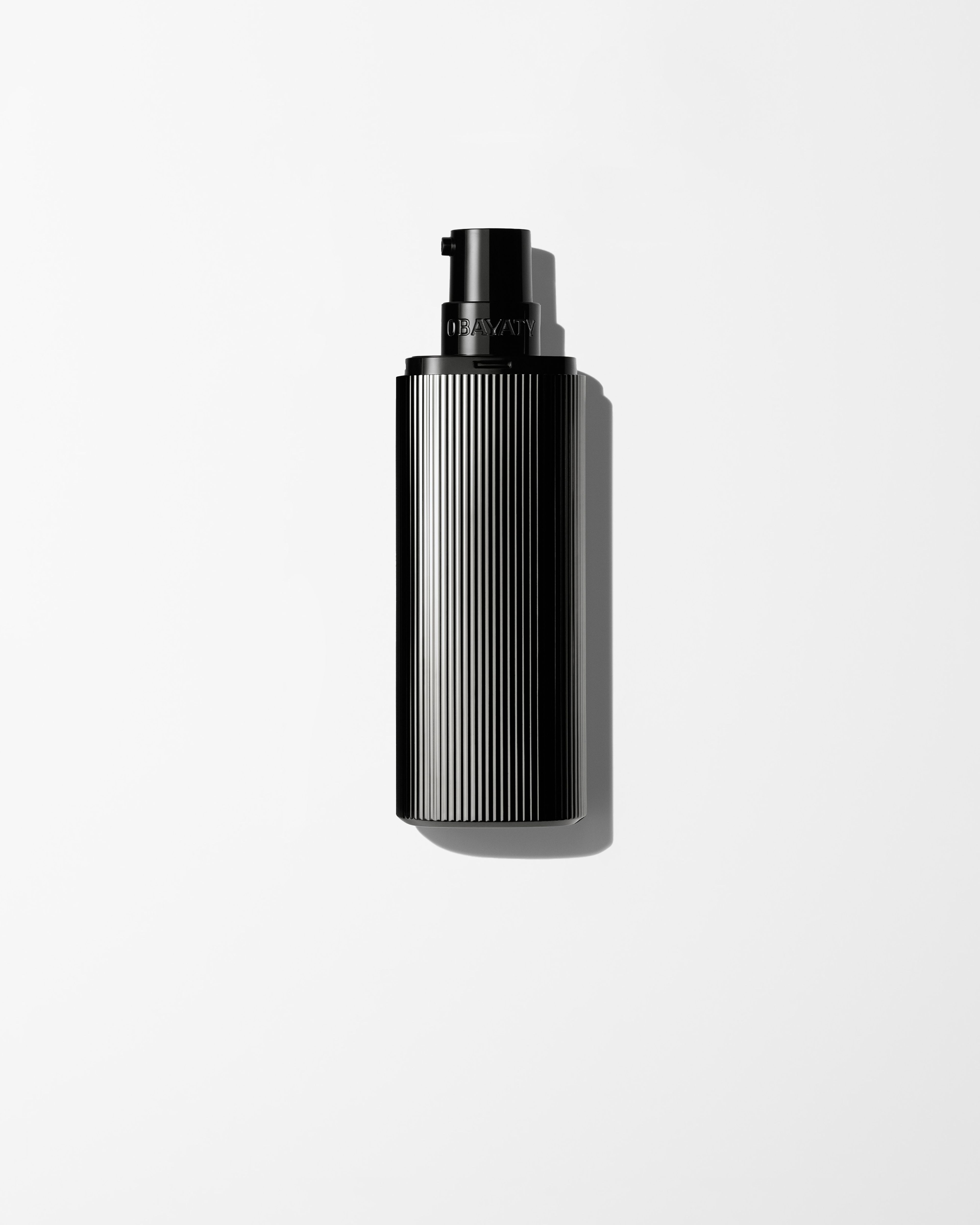 Men's tinted moisturizer laying on a grey surface
