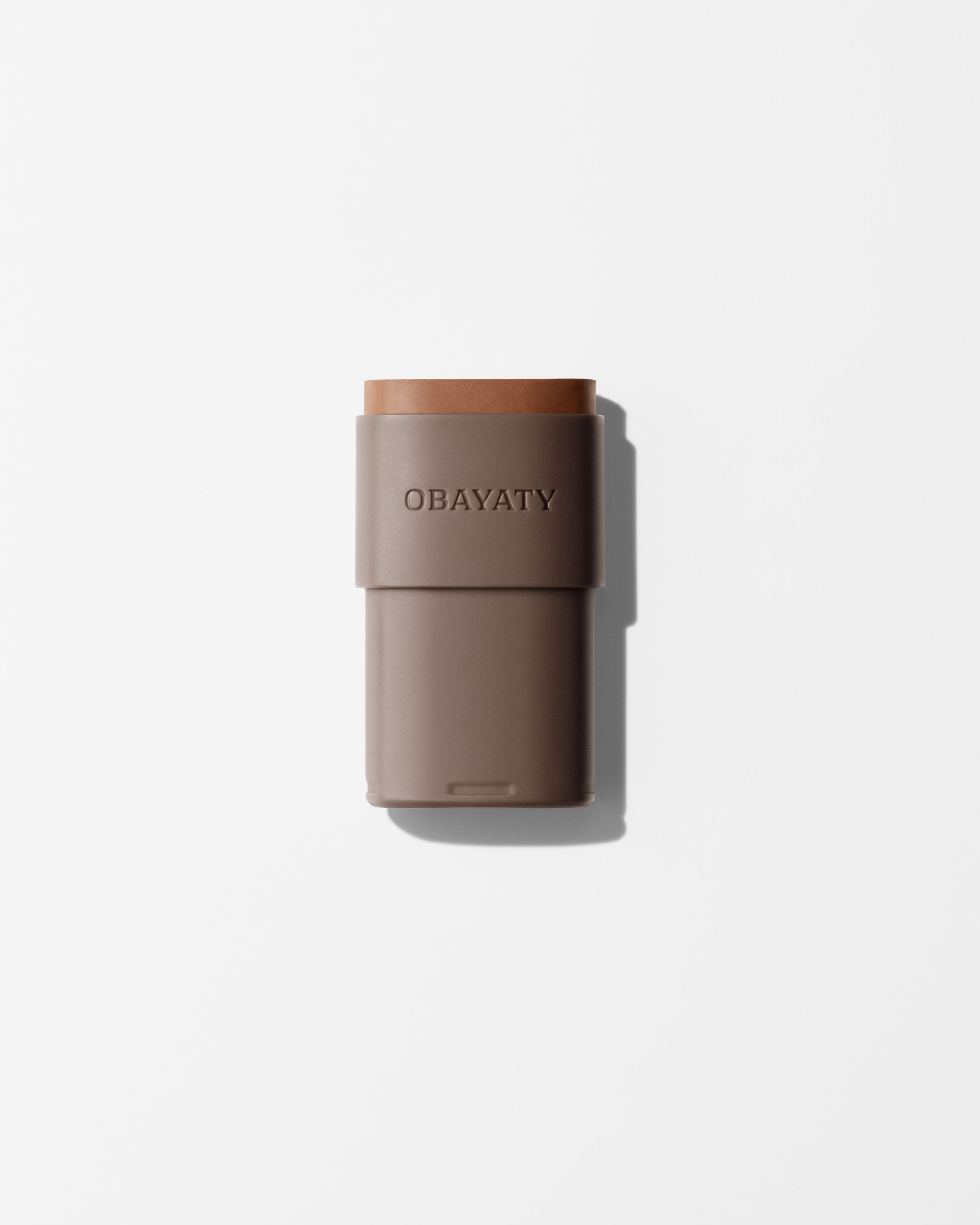 Bronzer refill laying on a grey surface