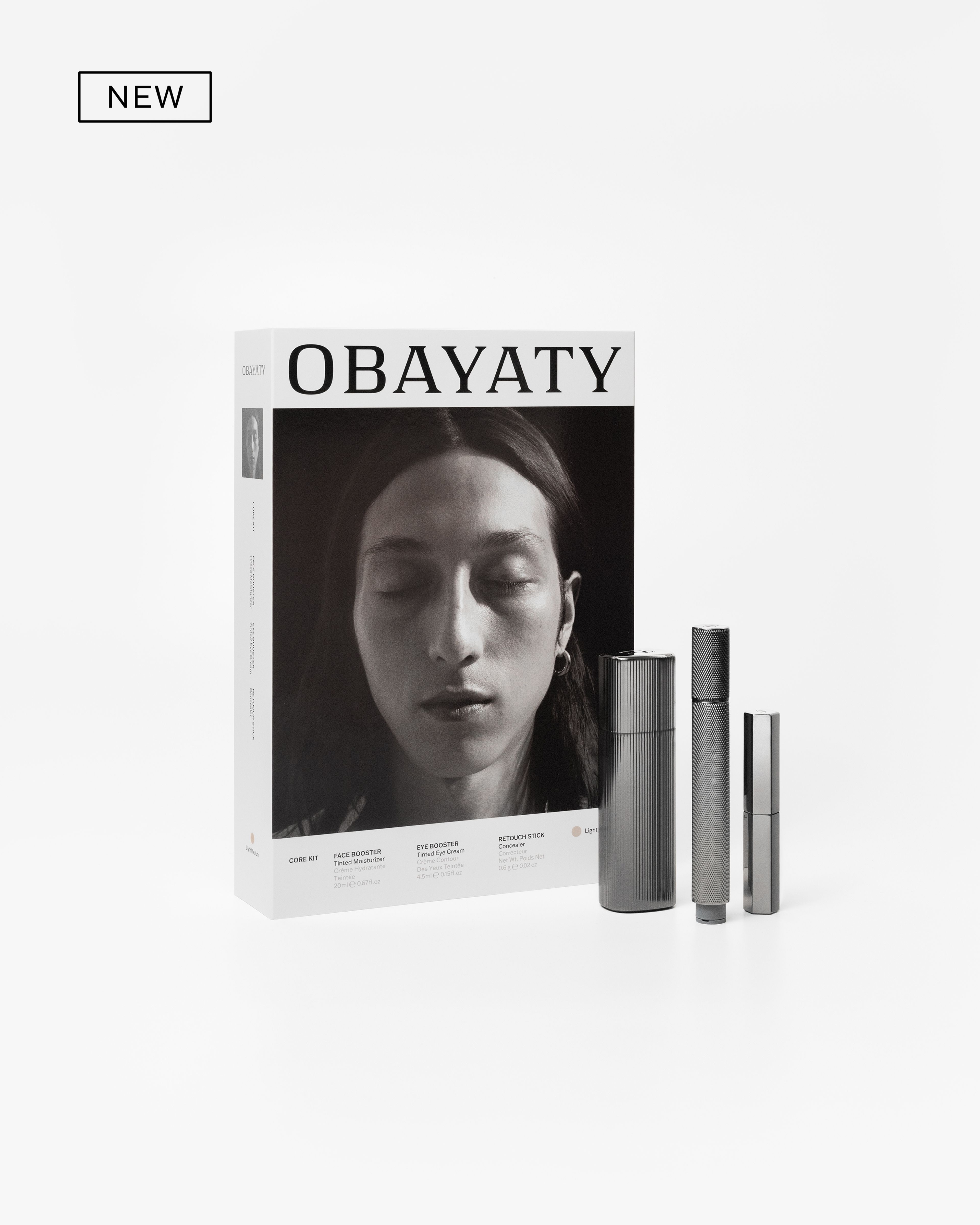 Men's make up kit laying on a grey background