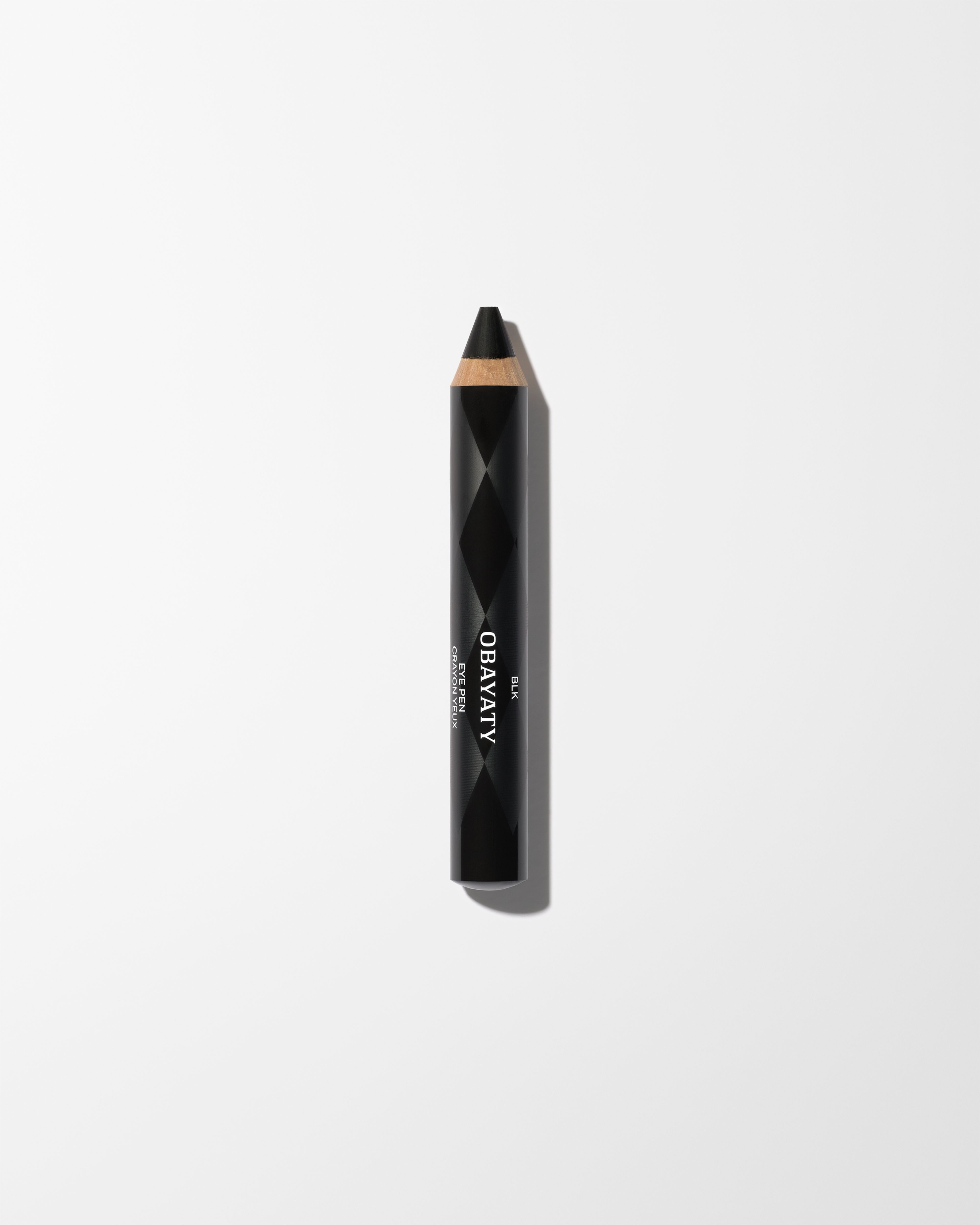 Eye Pen BLK laying on a grey surface