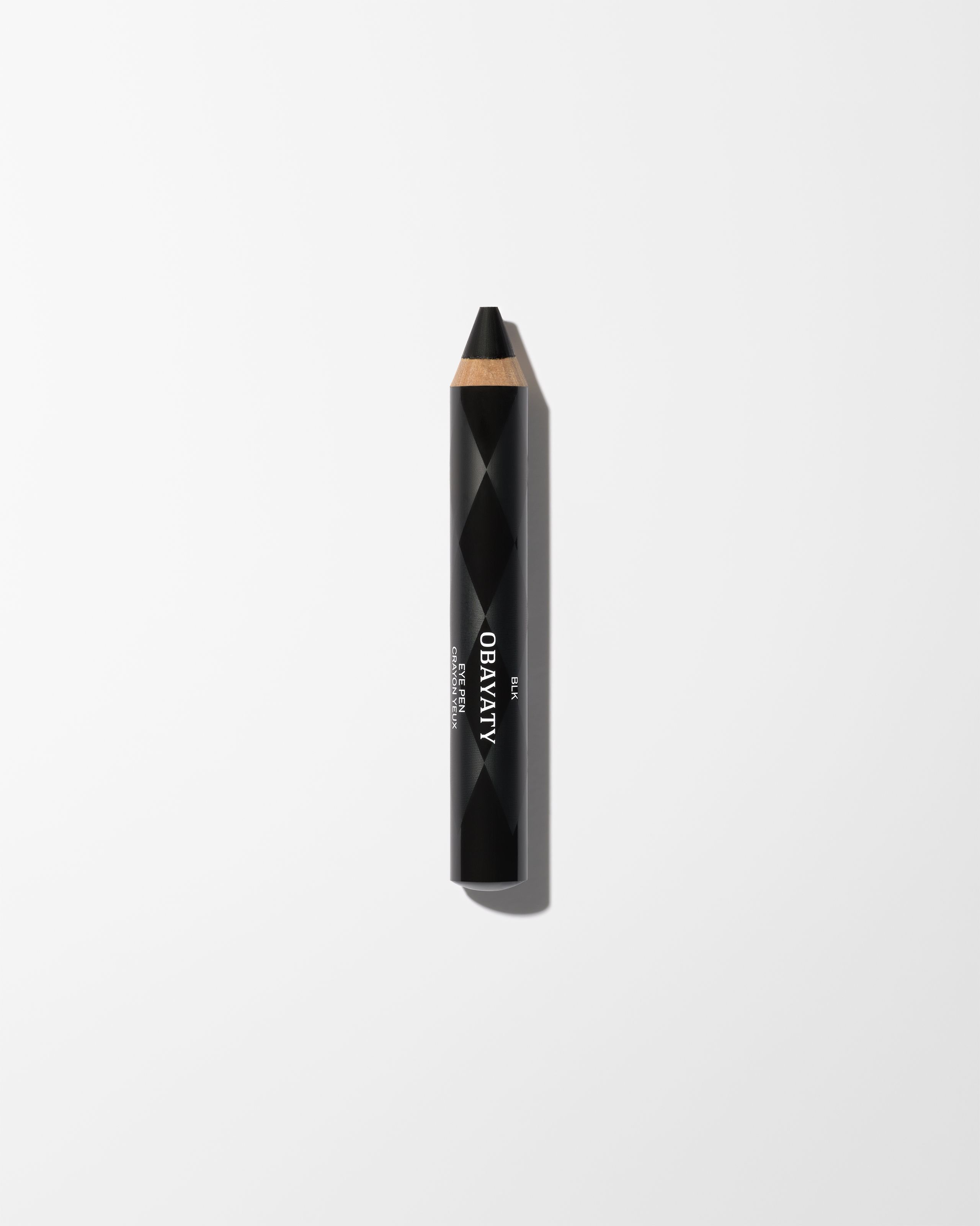 Eye Pen BLK laying on a grey surface