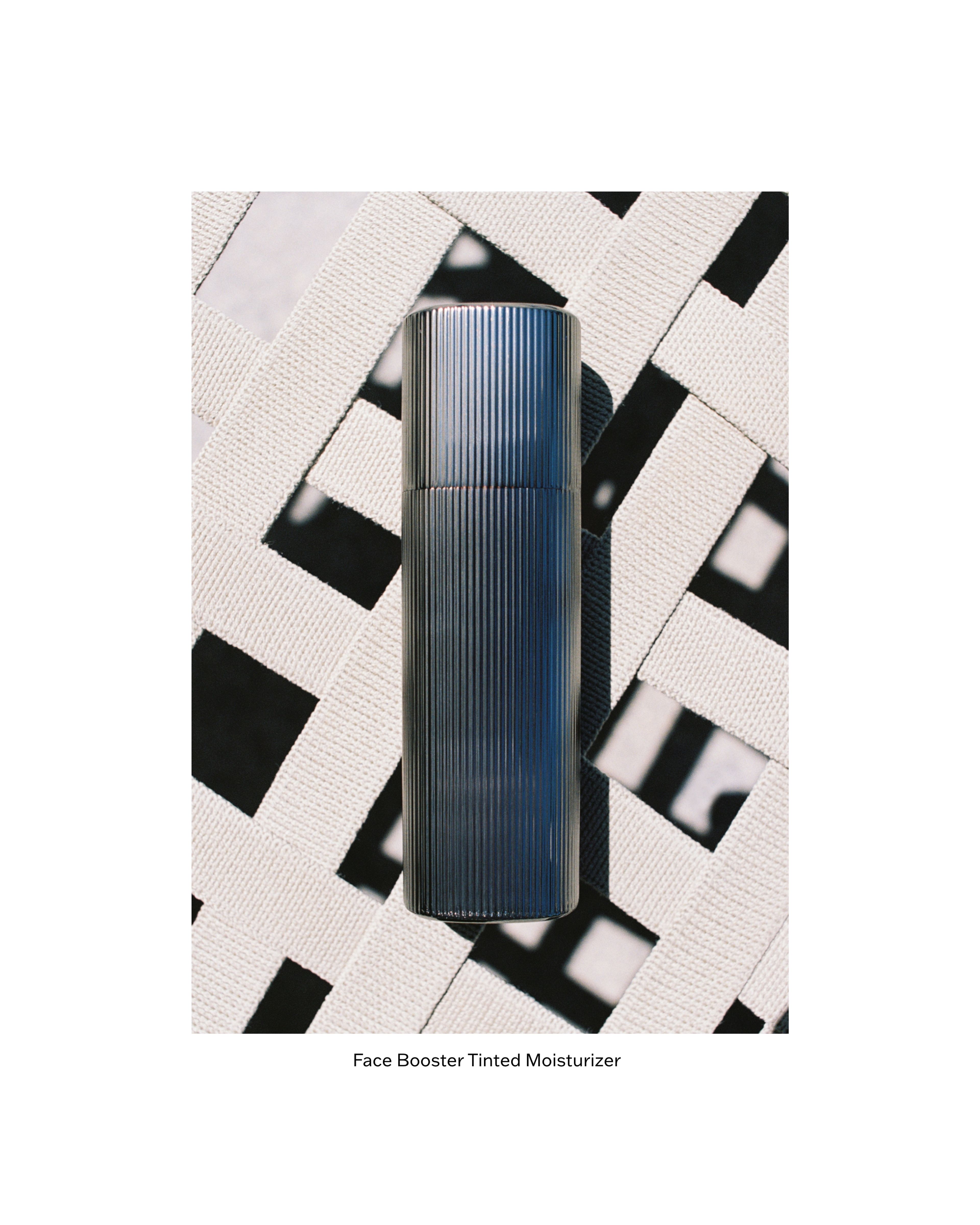 Men's tinted moisturizer laying on a sunbed