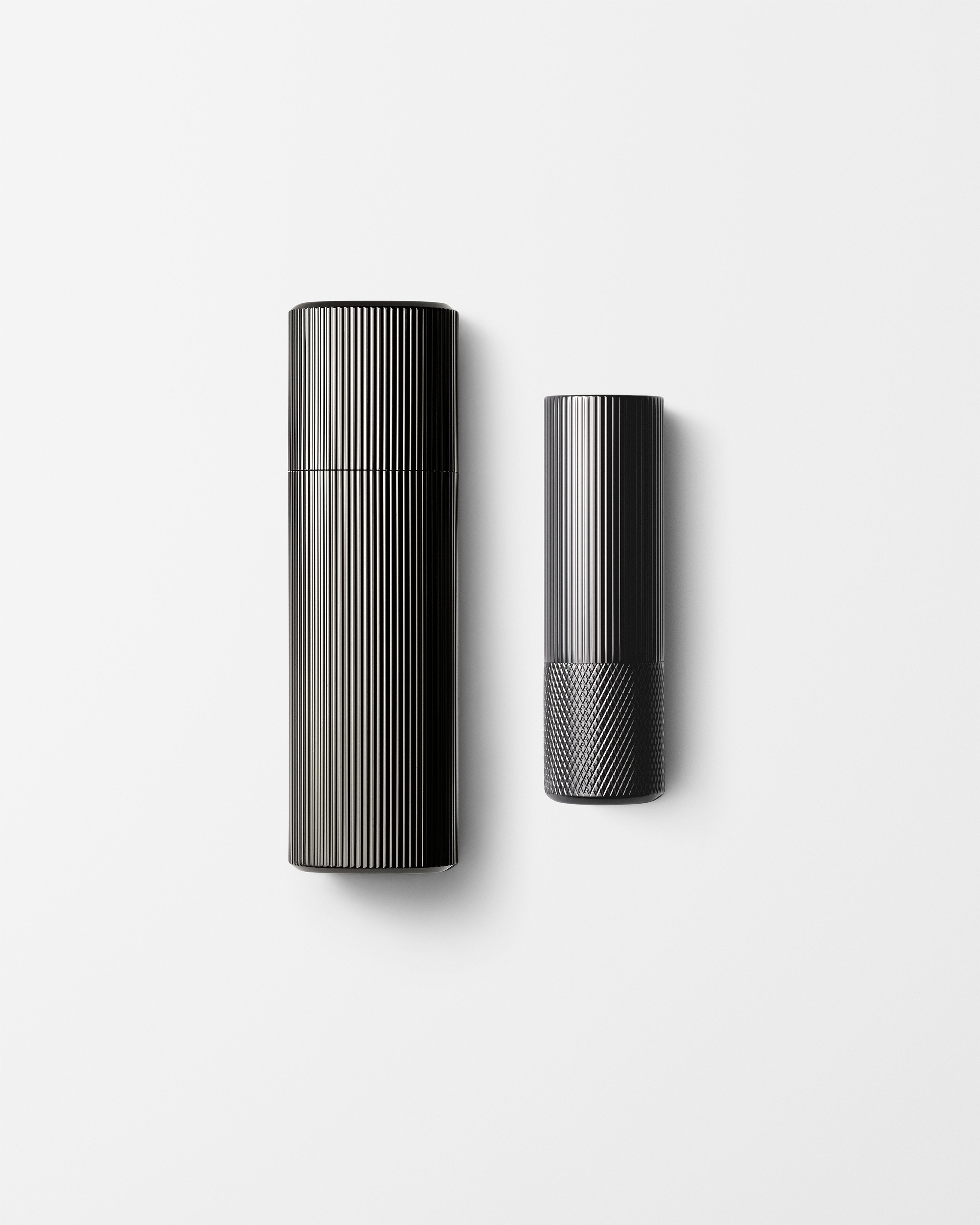 Men's moisturizer and lip balm laying on a grey background