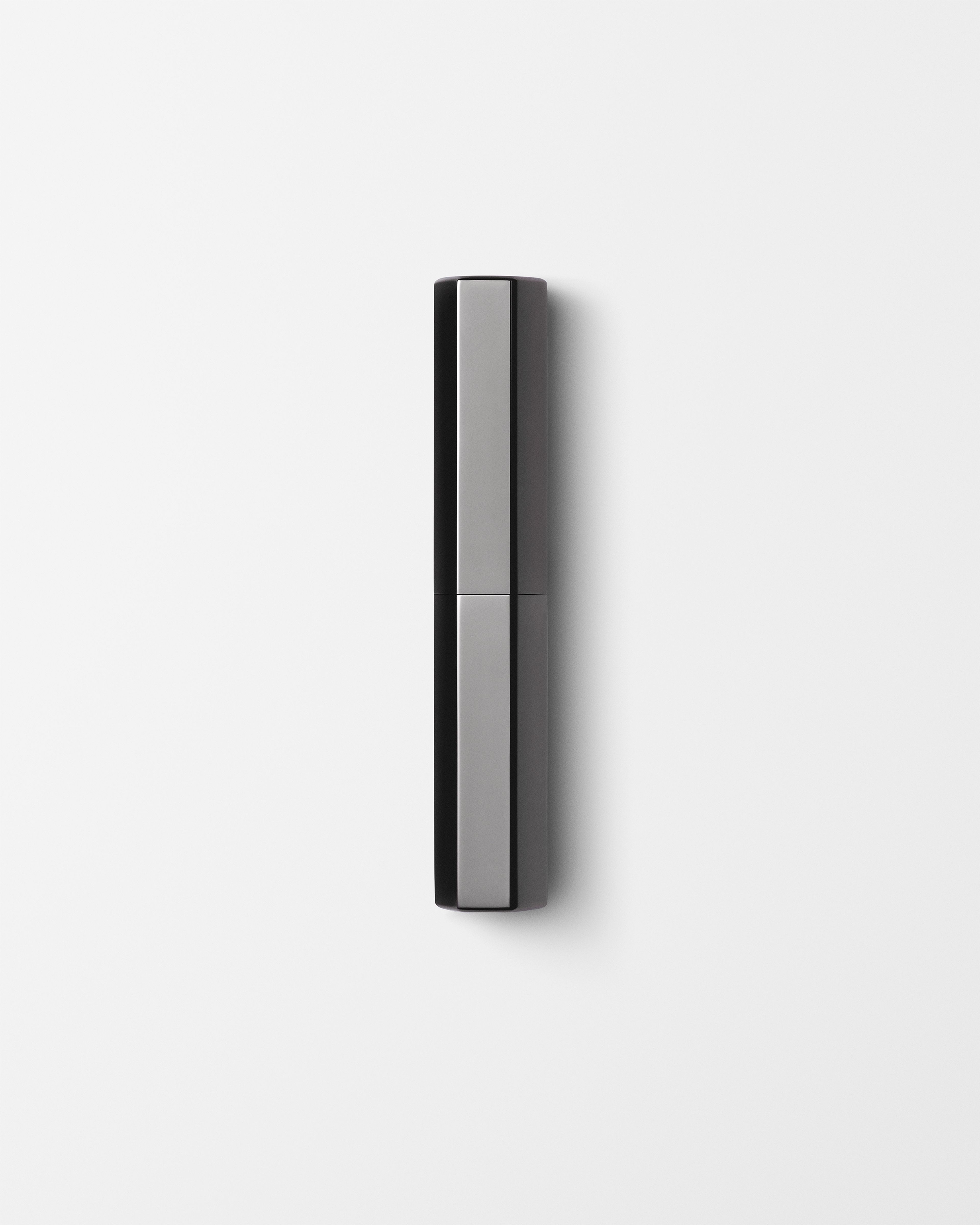 Men's concealer laying on a grey surface