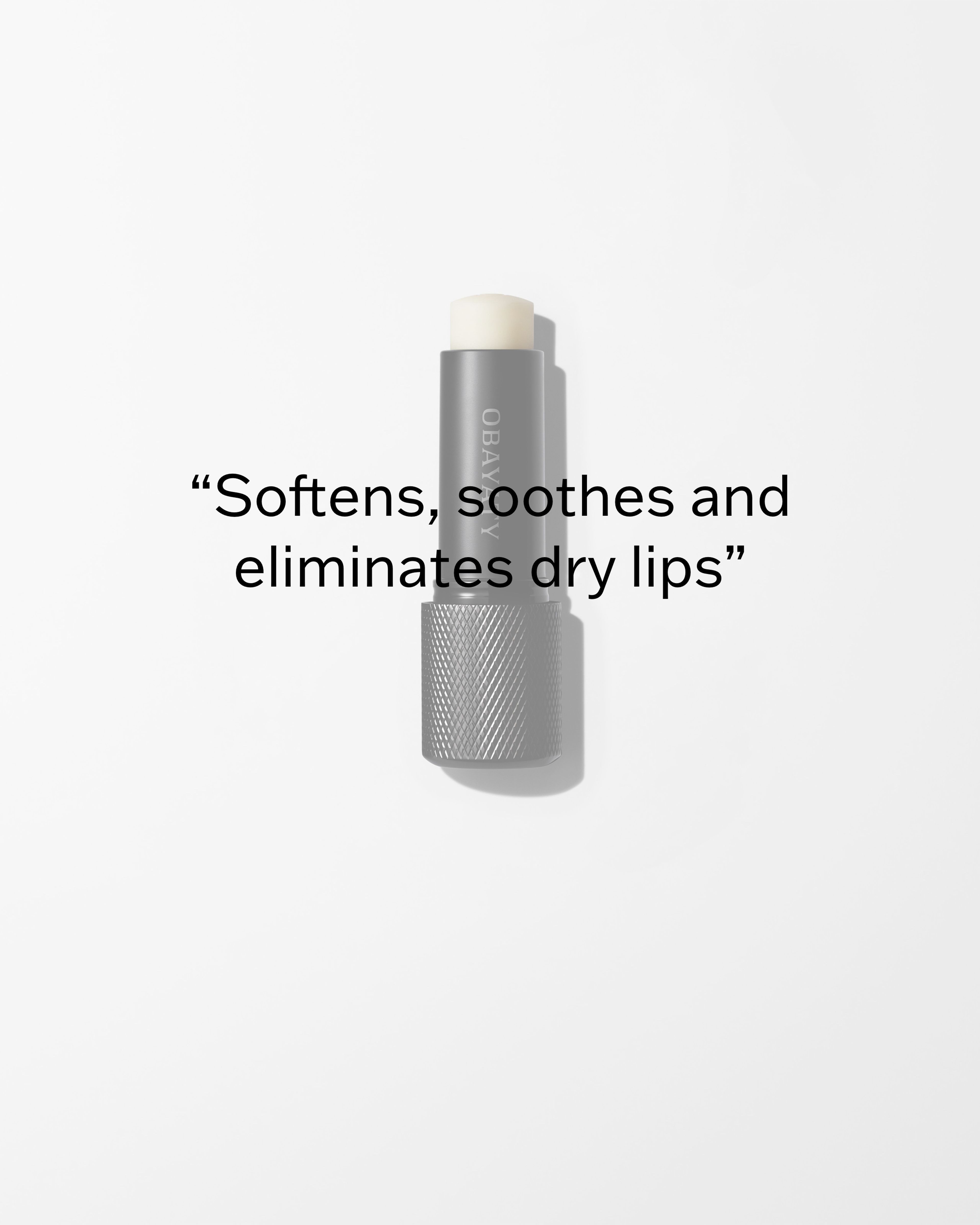 Soothing Lip Balm laying on a grey surface