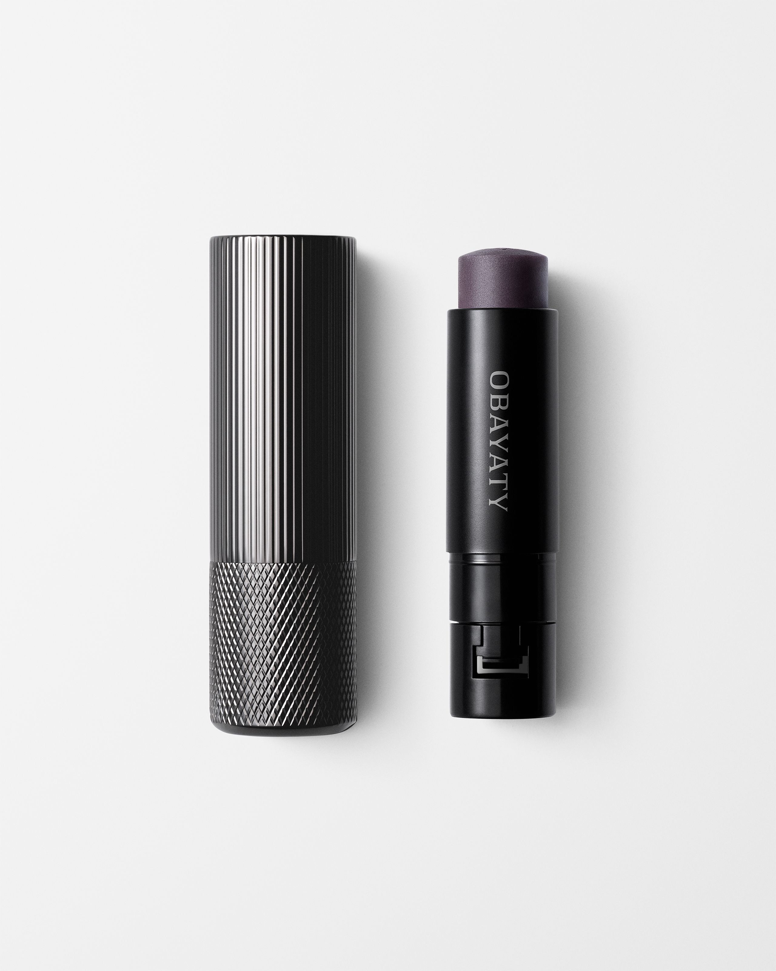 Lip Balm for men laying on a grey surface