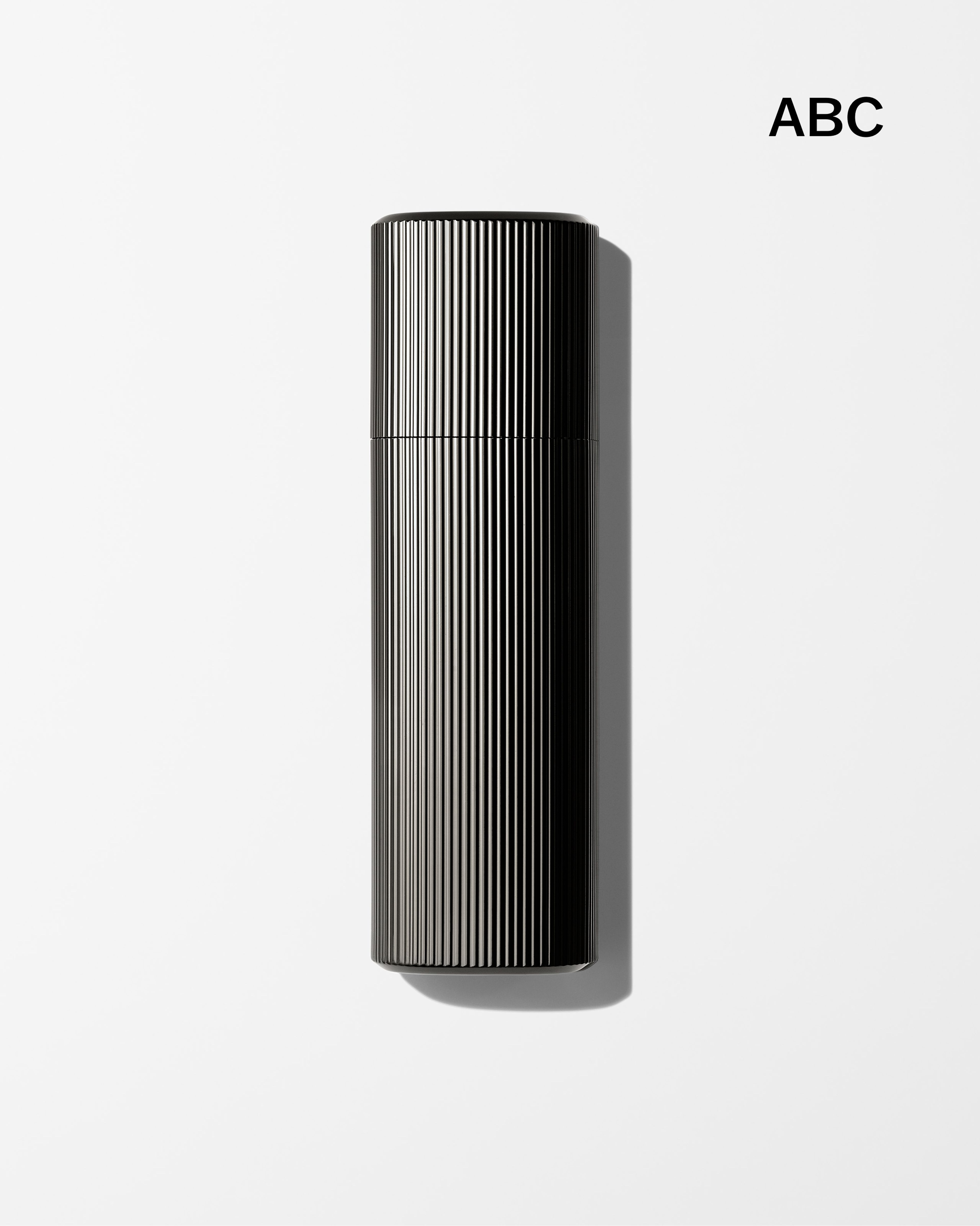 Men's tinted moisturizer laying on a grey surface