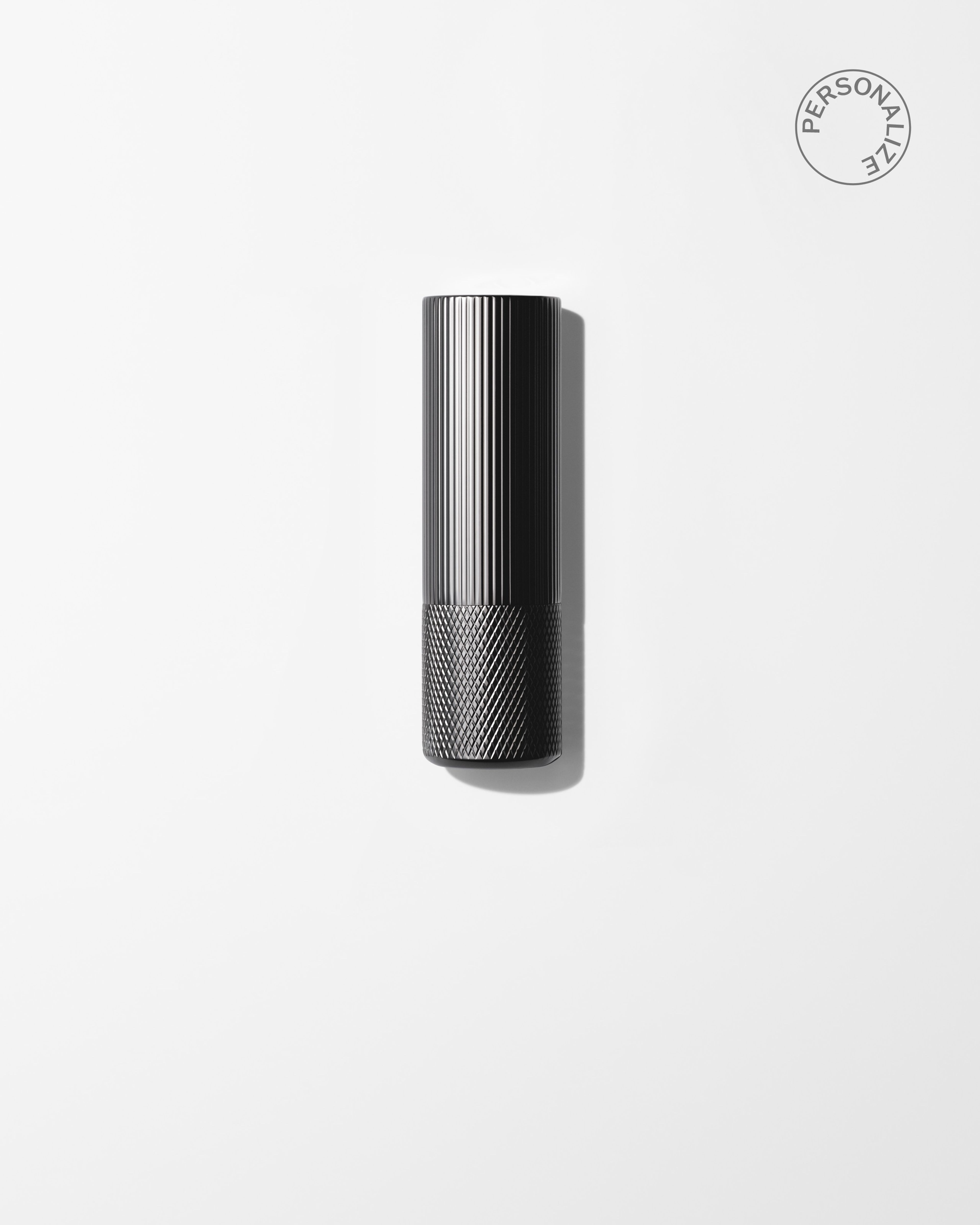 Soothing Lip Balm laying on a grey surface