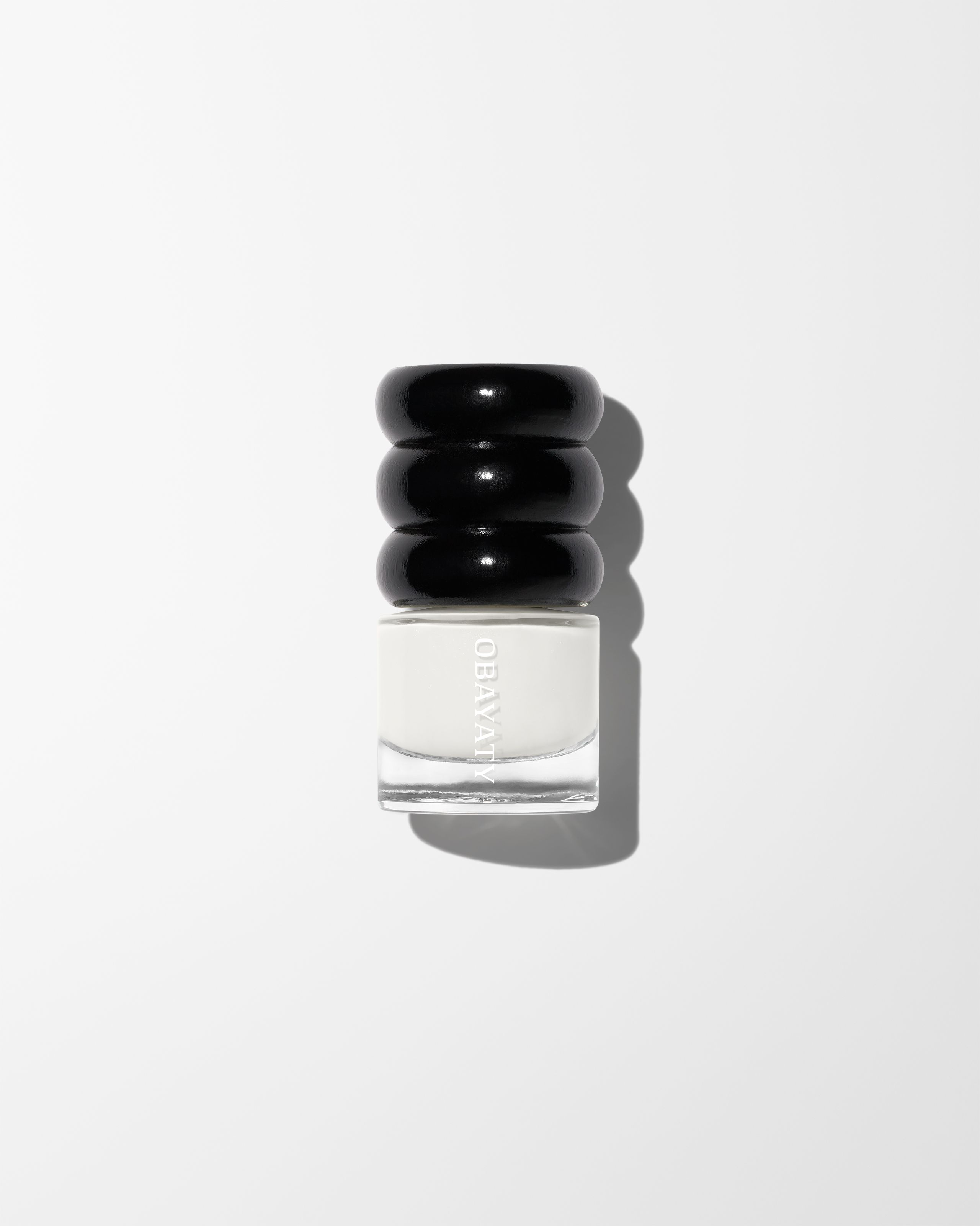 Nail brightener laying on a grey background