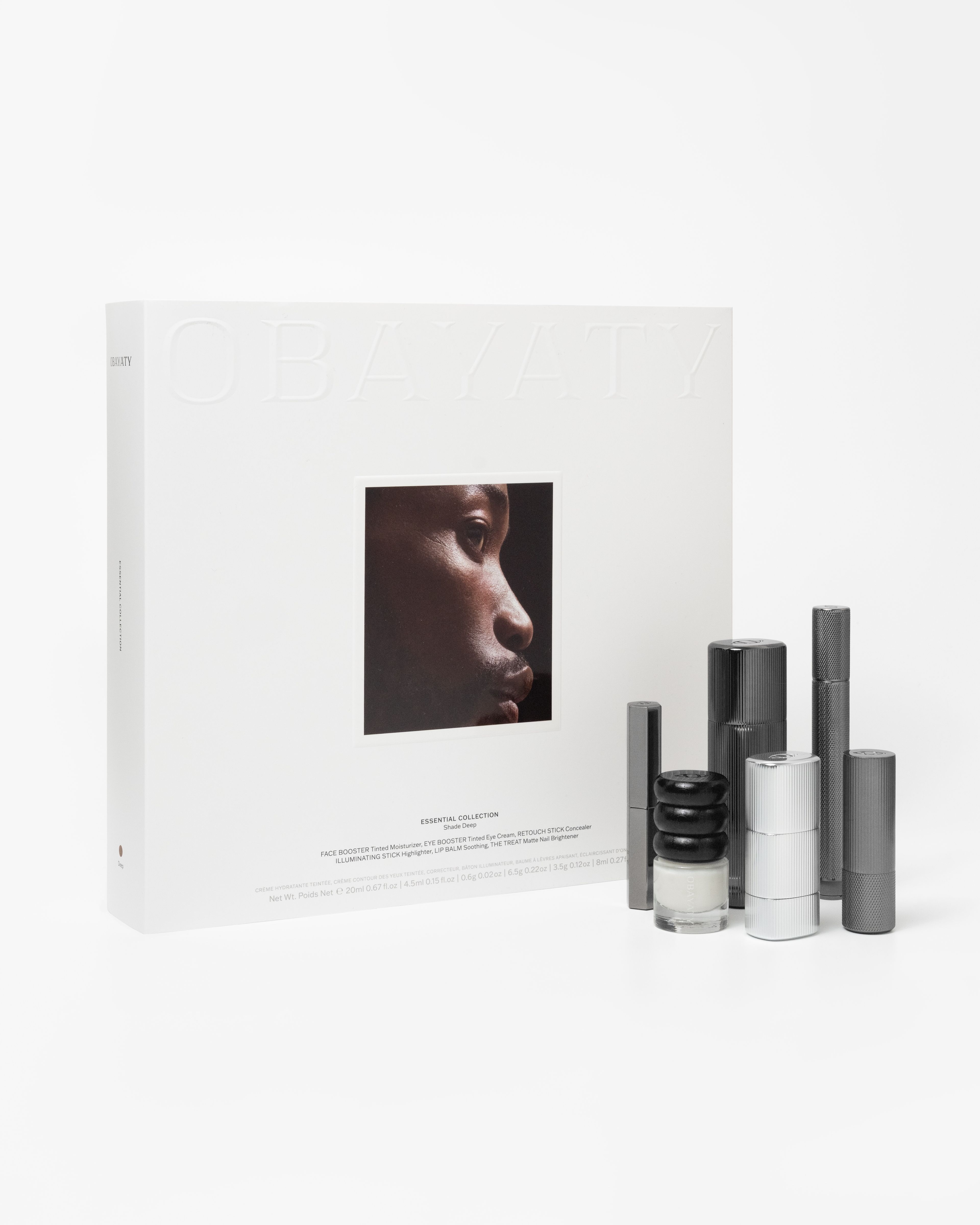 Make up kit for men laying on a grey background