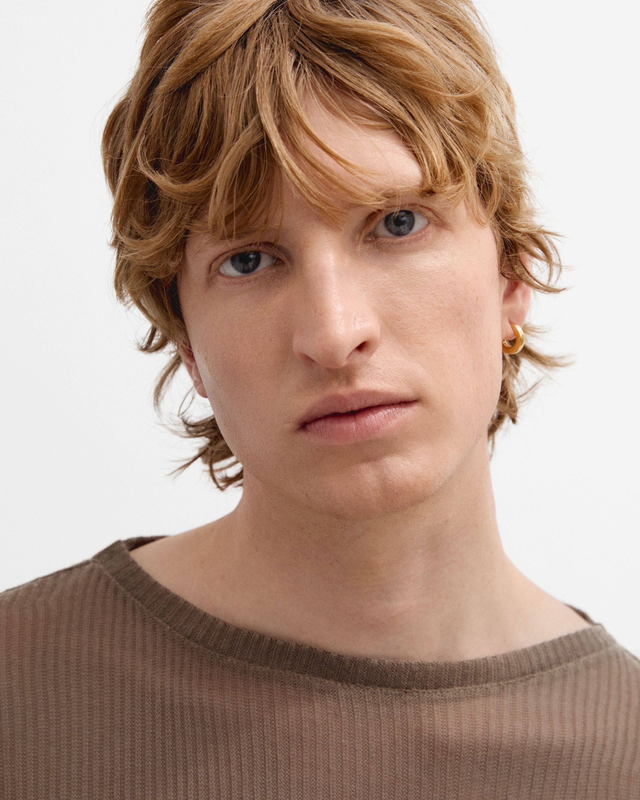 Man looking in to the camera with the mens concealer applied