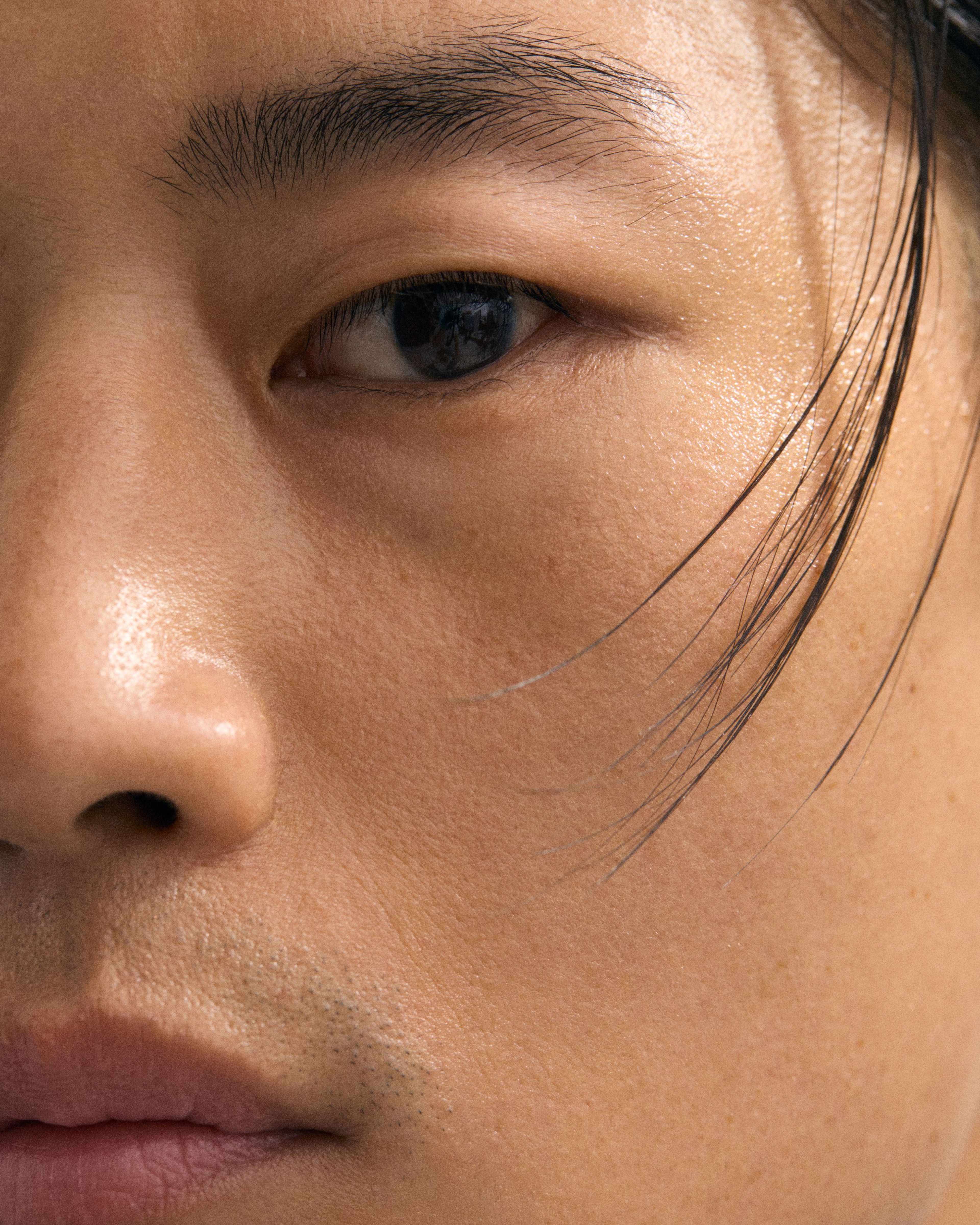 Man looking in to the camera with highlighter applied