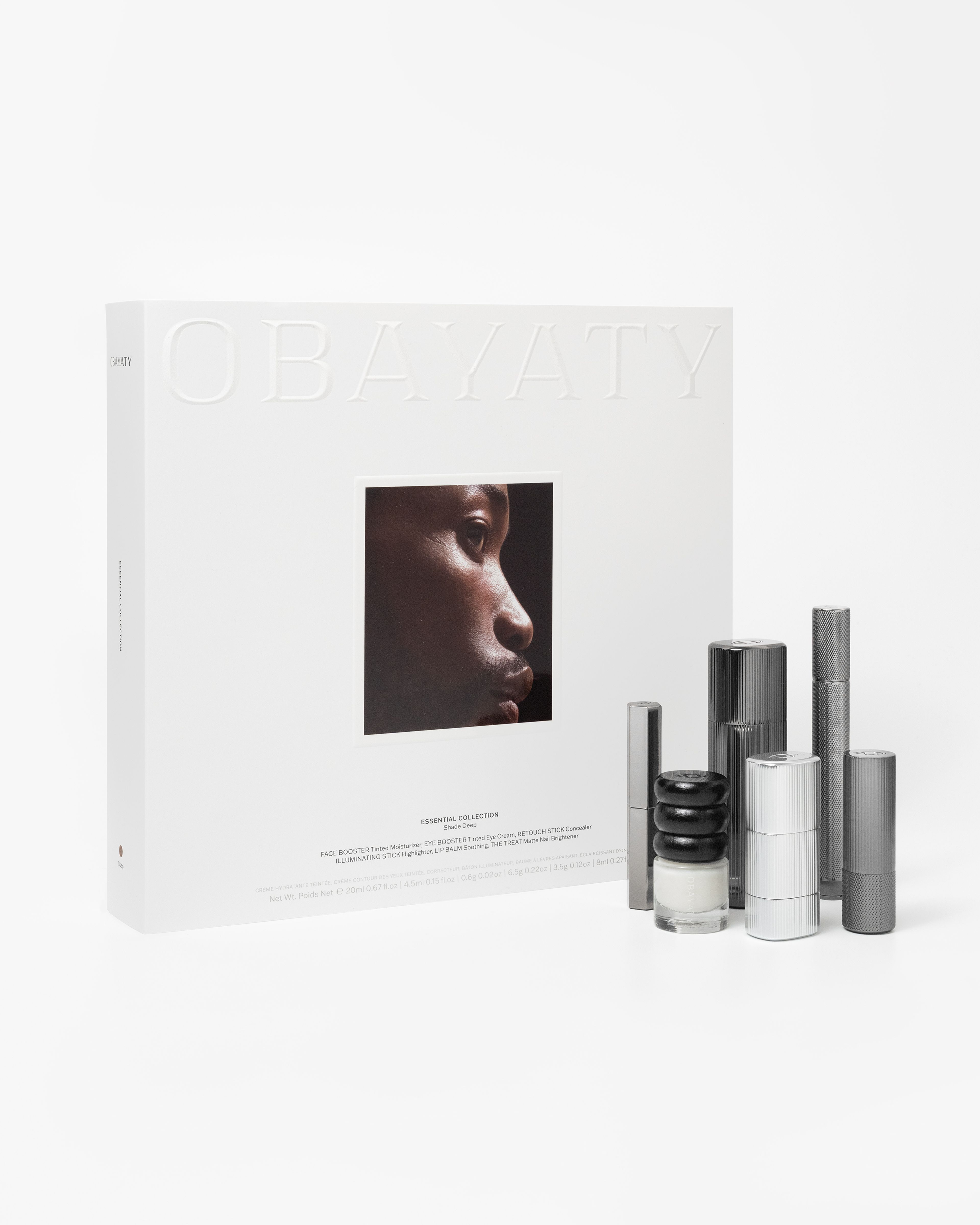 Make up kit for men laying on a grey background