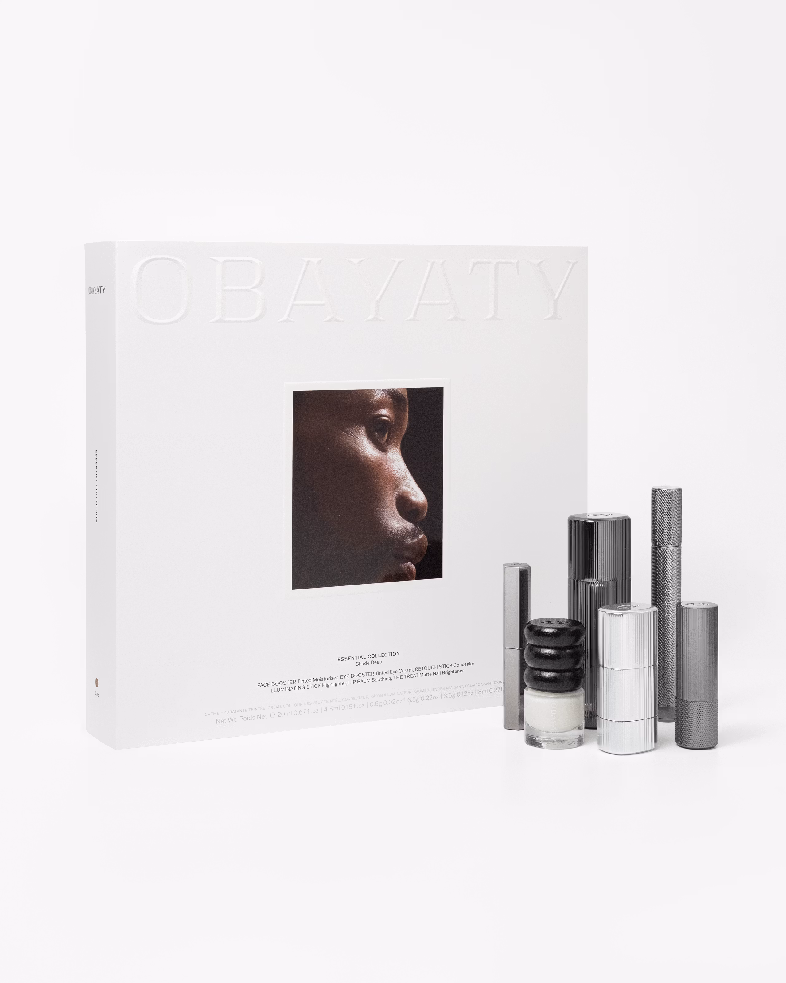 Make up kit for men laying on a grey background