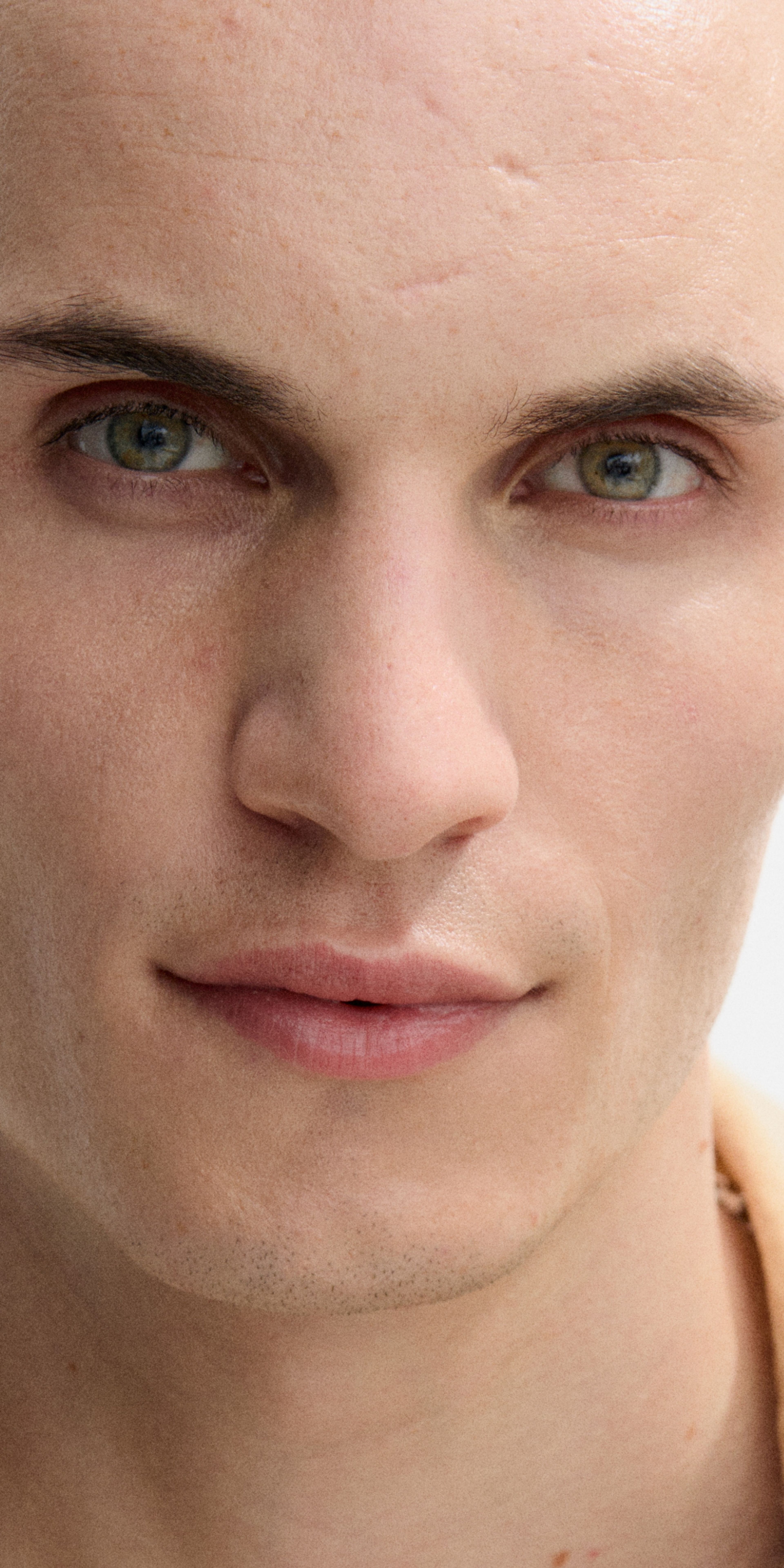 Man looking into the camera with face booster applied