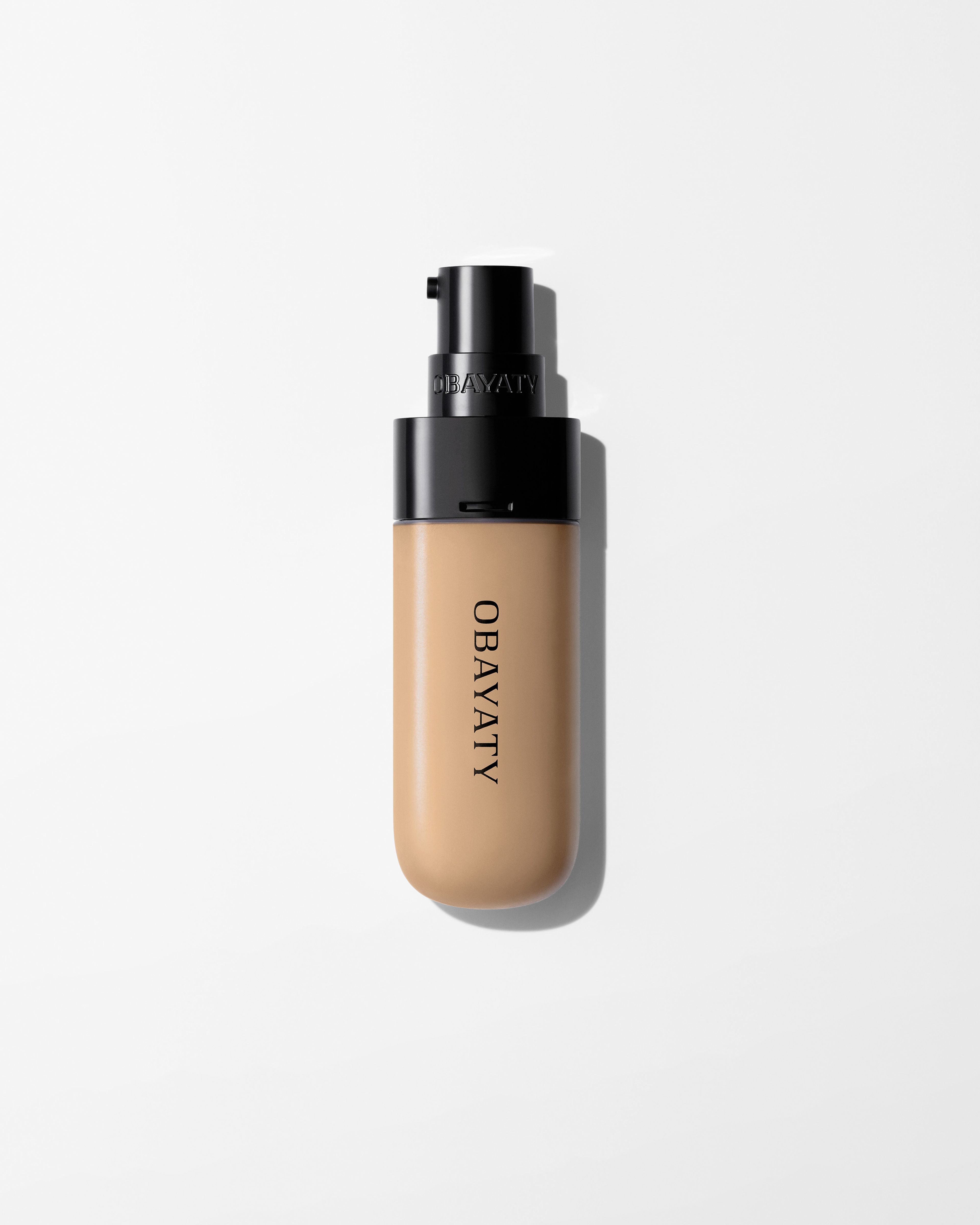 Tinted moisturizer refill laying on a grey surface