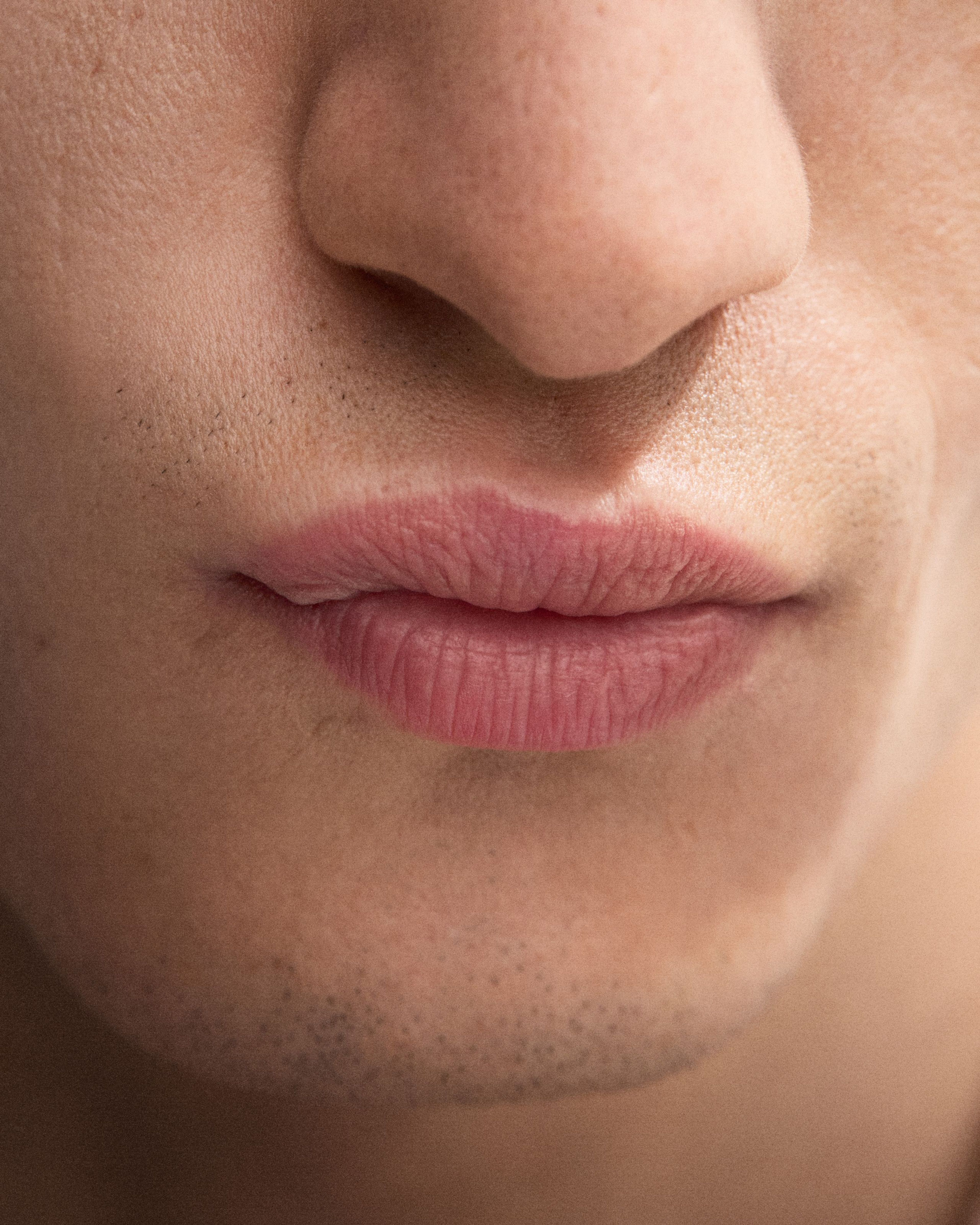 Man with the Anti-Rouge Lip Balm applied