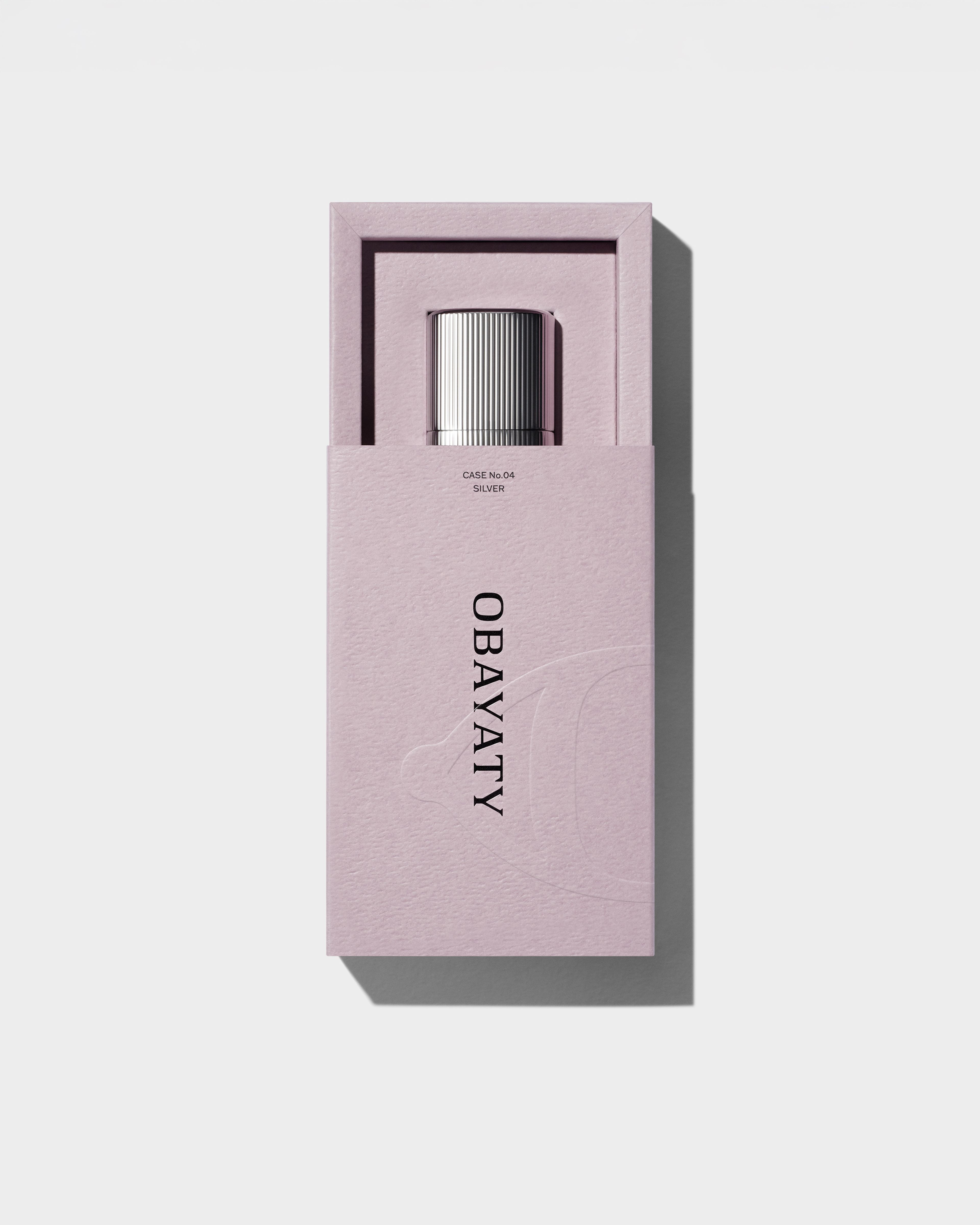 Open highlighter packaging laying on a grey surface