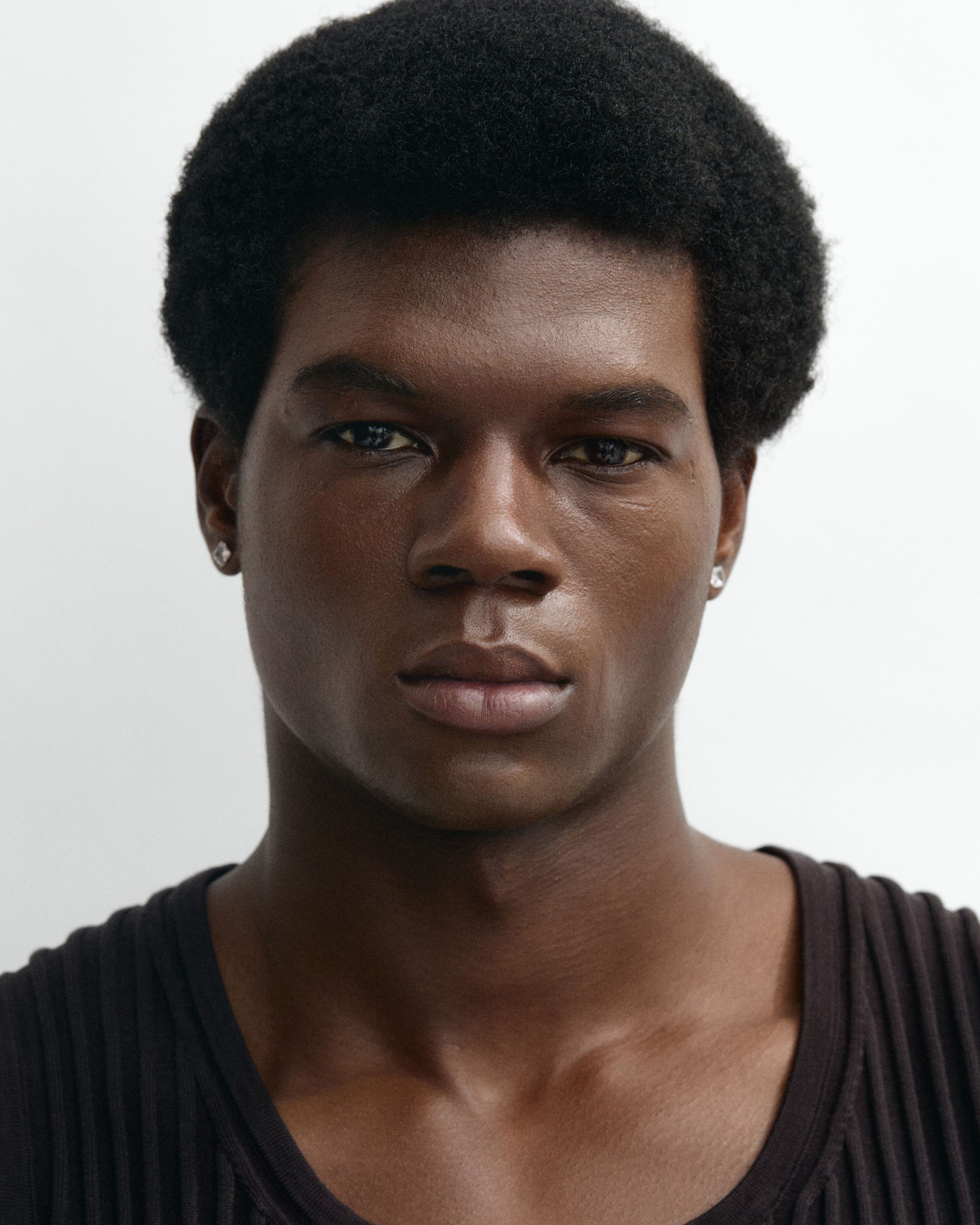 Man looking into the camera with the tinted moisturizer applied