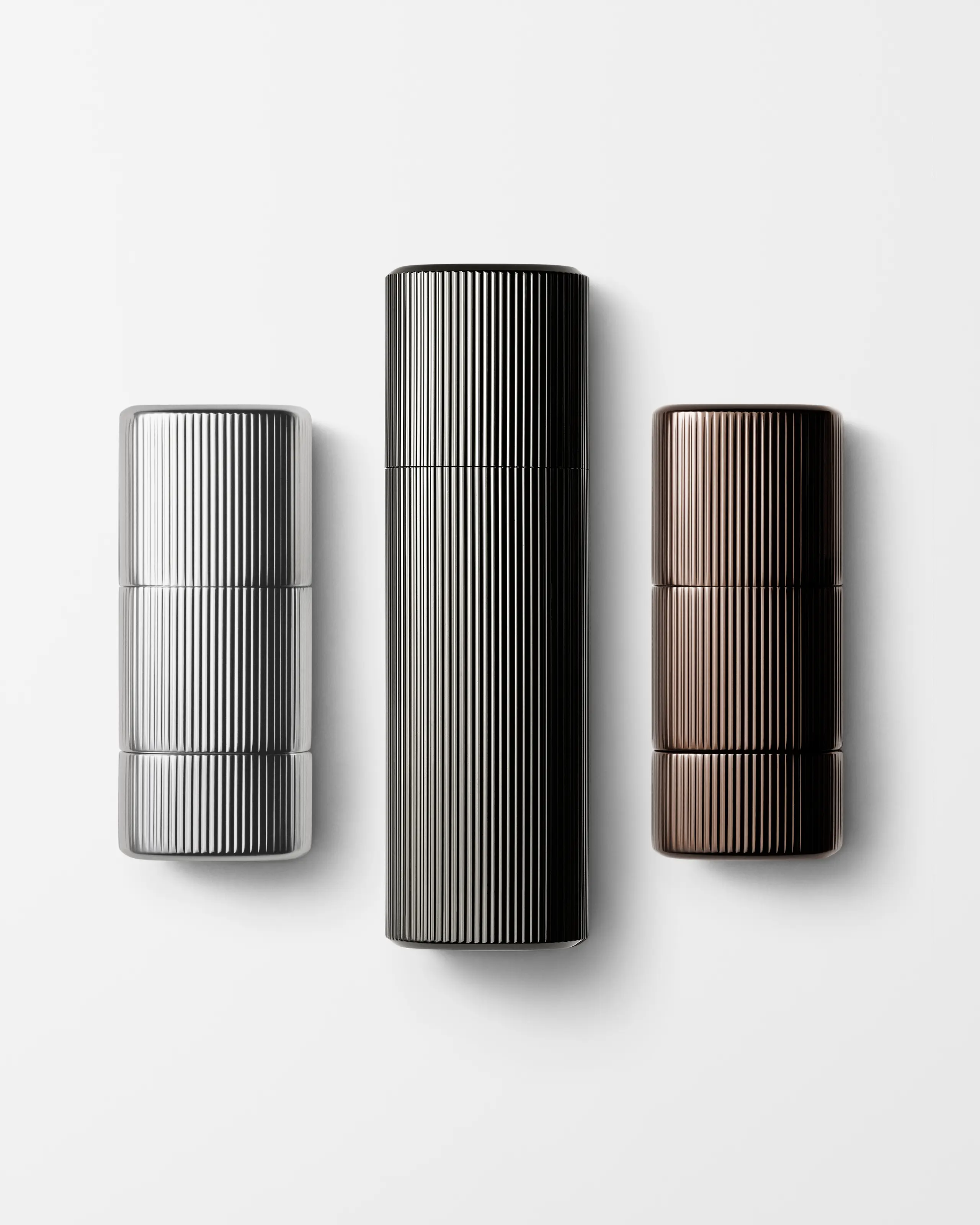 Men's kit of make up products laying on grey background