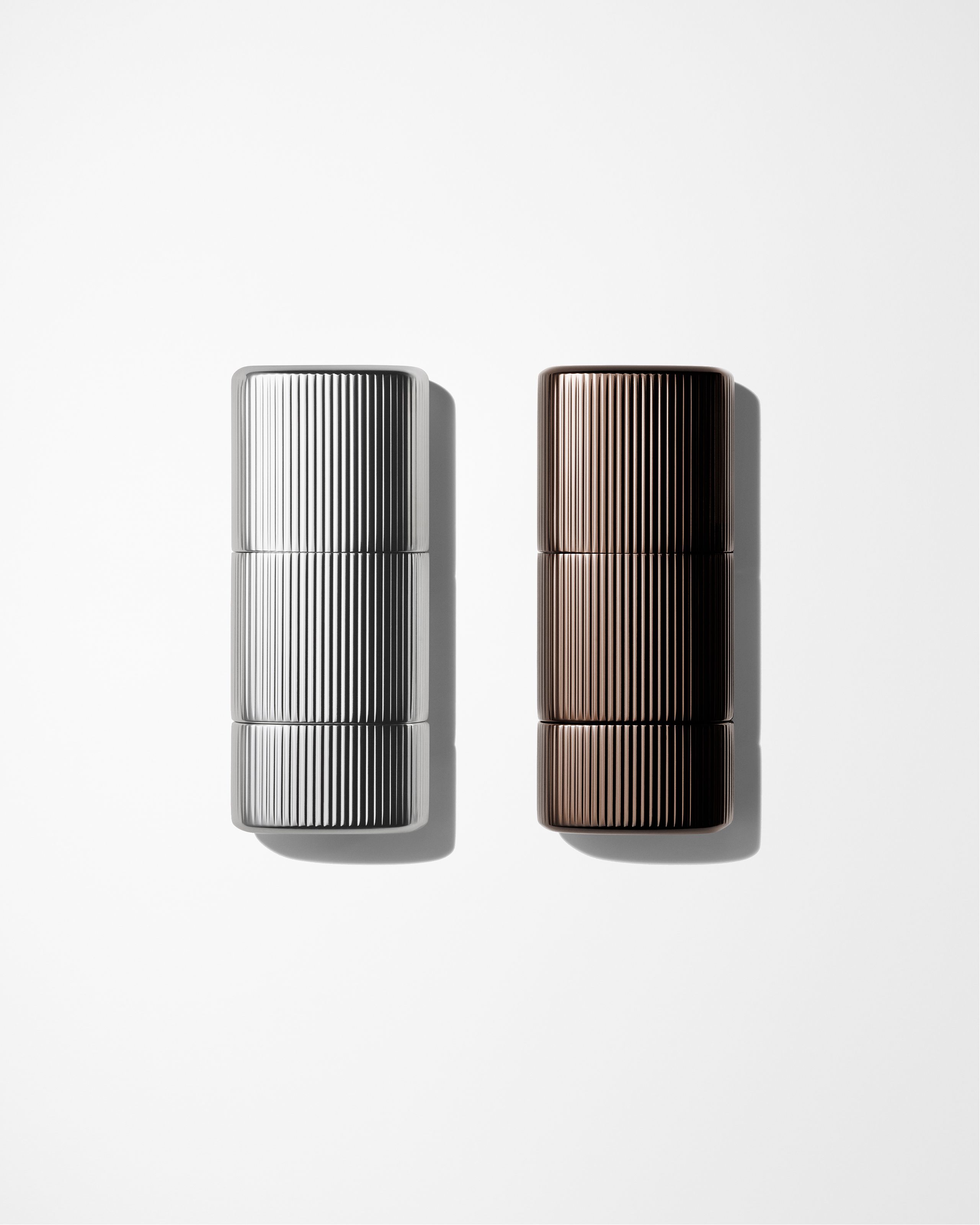 Make up kit for men laying on a grey background