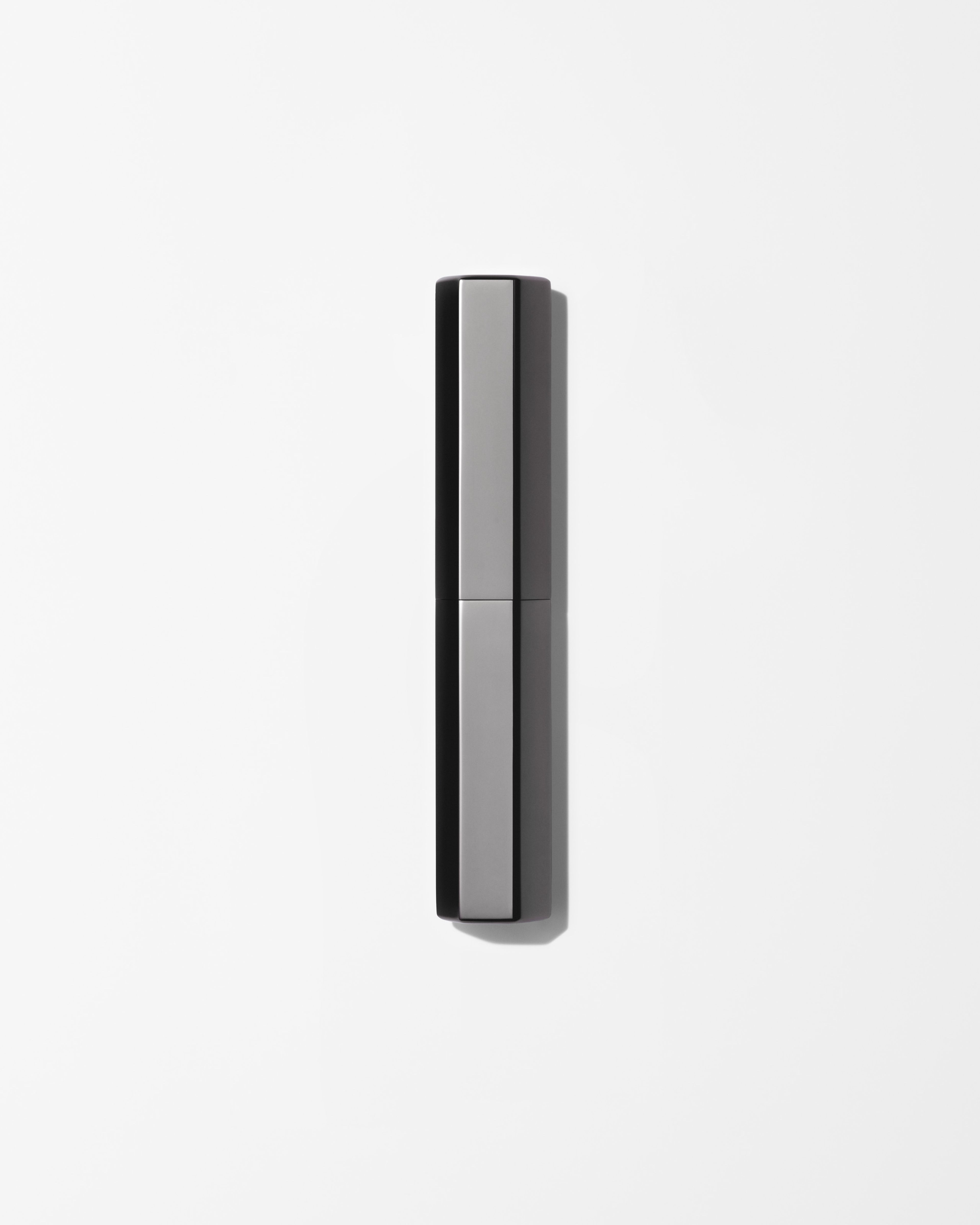 Men's concealer laying on a grey surface