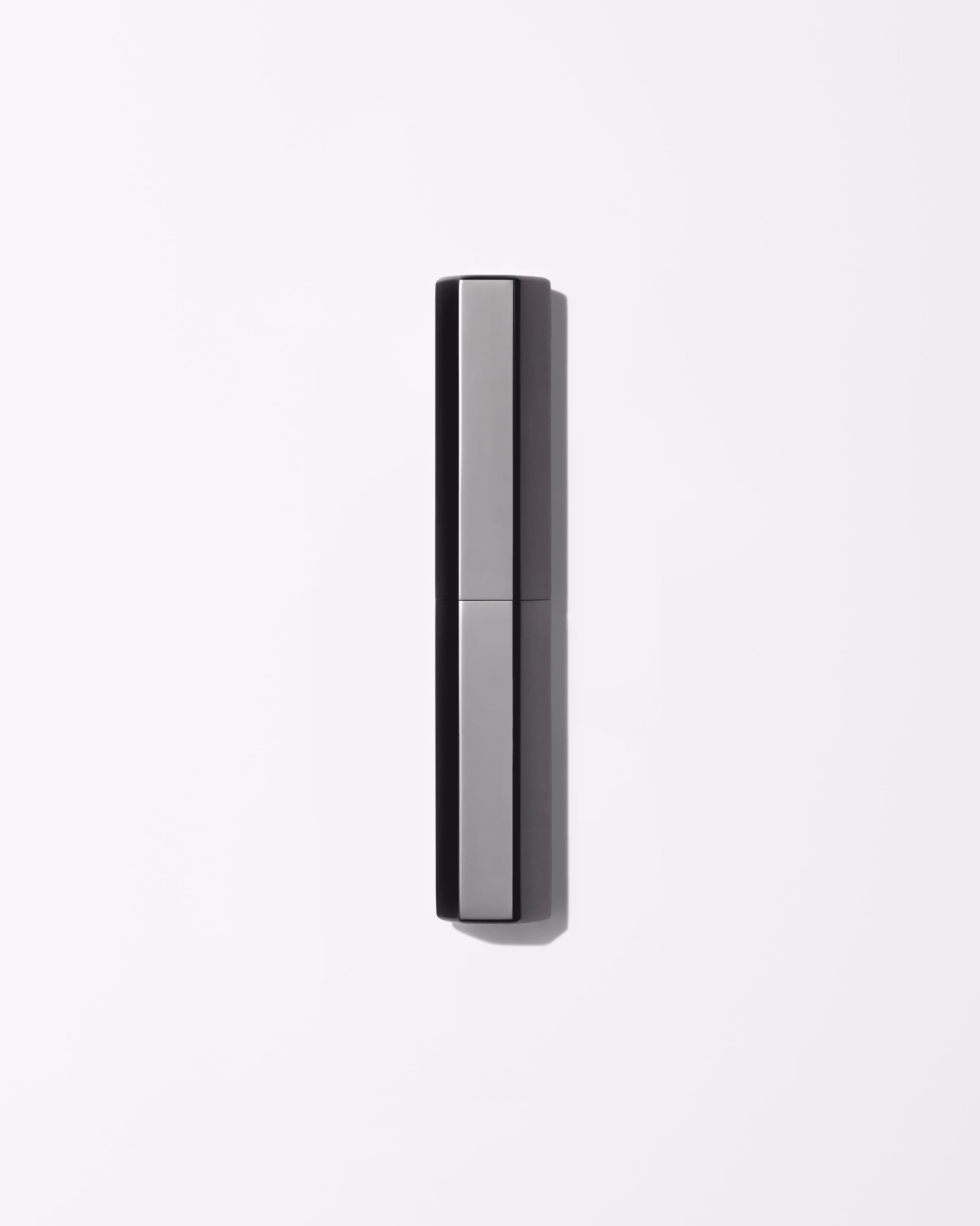 Men's concealer laying on a grey surface
