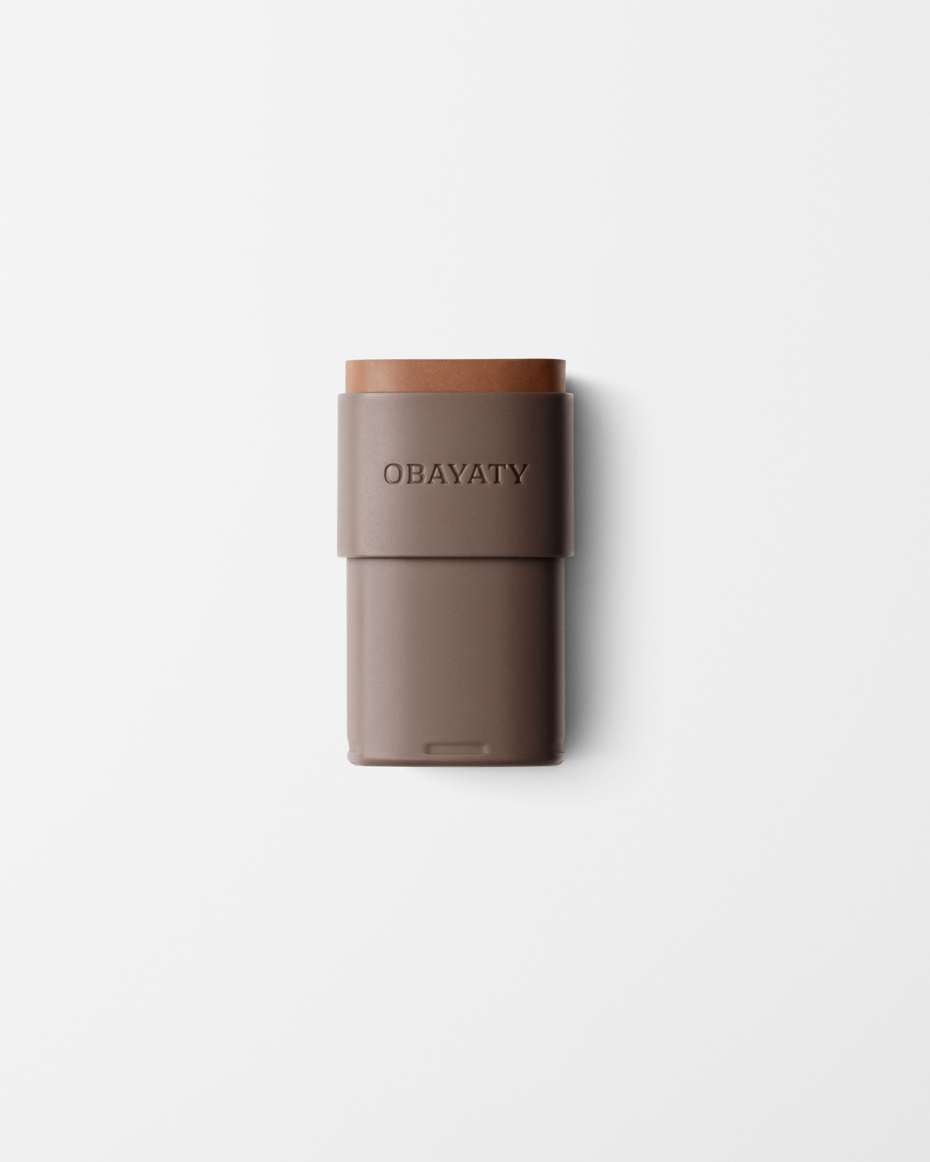 Bronzer refill laying on a grey surface